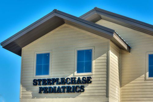 Building exterior with sign reading