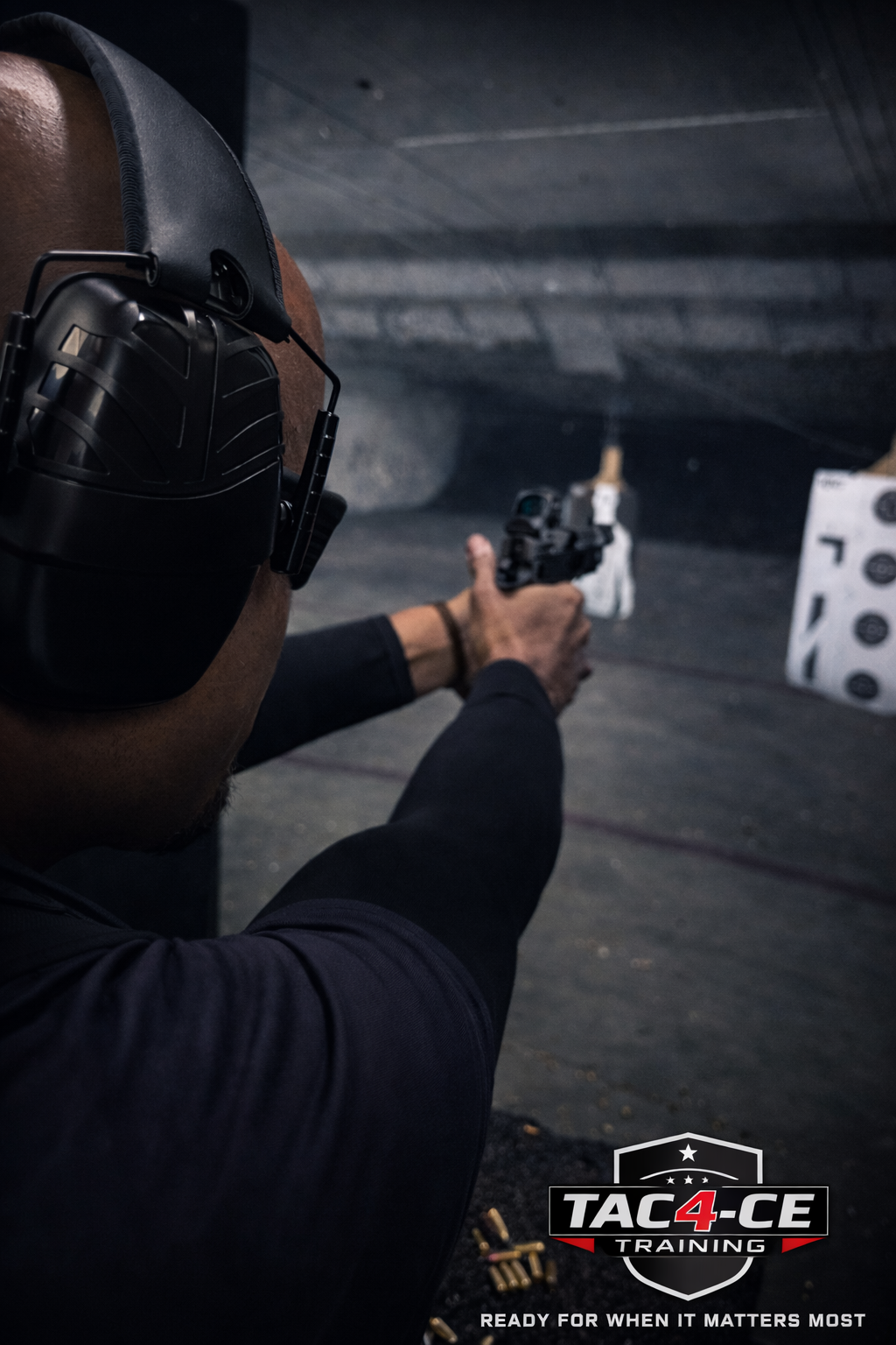 Man practicing defensive pistol shooting at indoor range during TAC-4CE Training in South Florida
