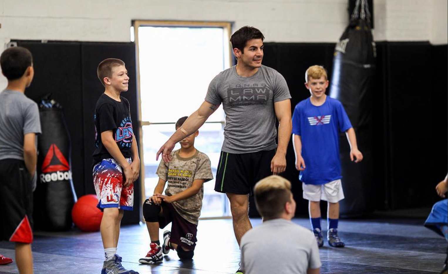 Students drilling Brazilian Jiu Jitsu at Ray Longo's Mixed Martial Arts in Garden City, NY.