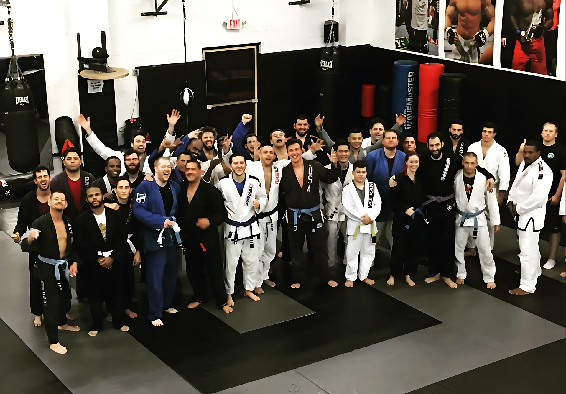 Adults training MMA together at Ray Longo's Mixed Martial Arts in Garden City, NY, building fitness.