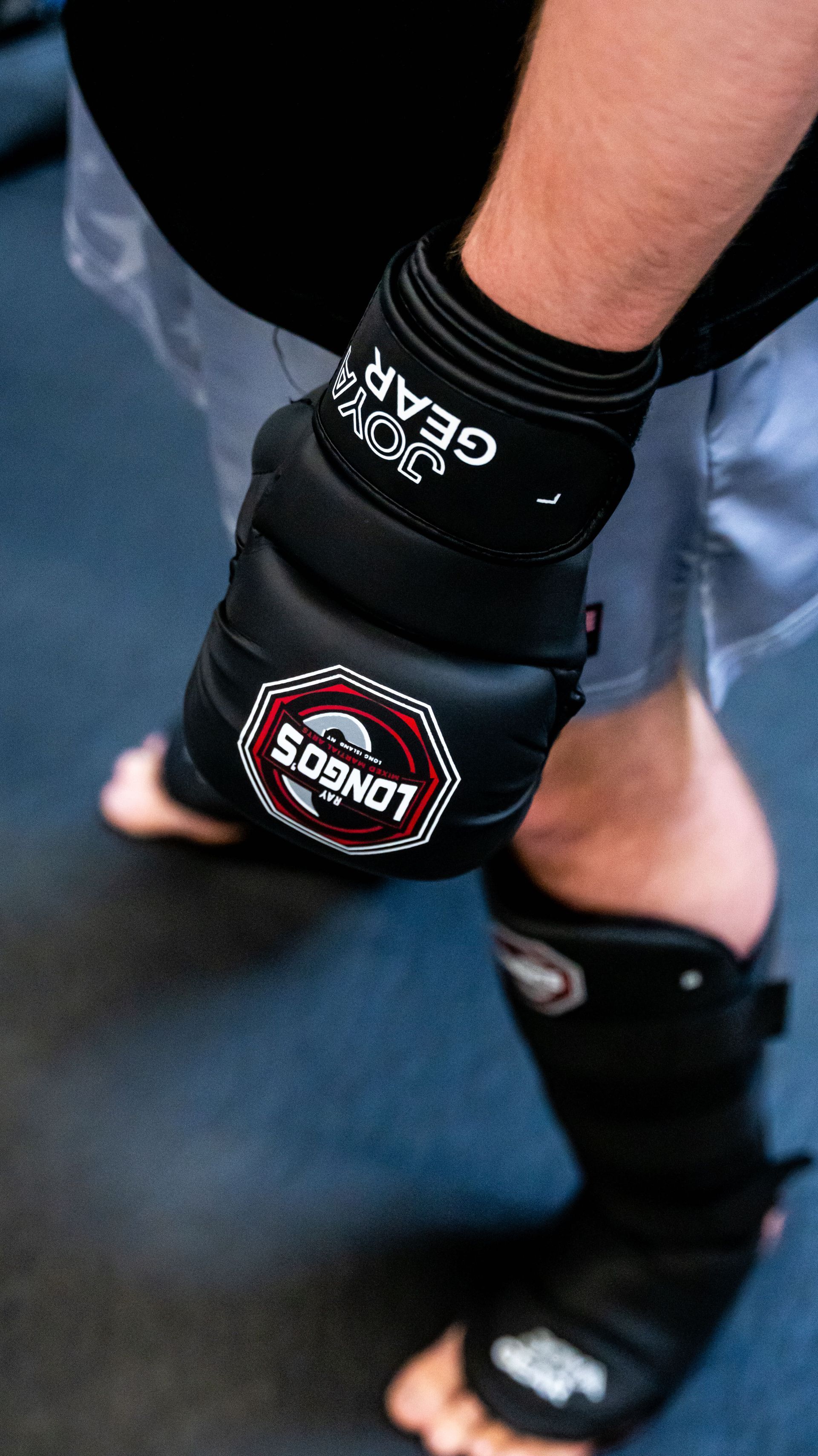 Adults drilling MMA striking and grappling at Ray Longo's Mixed Martial Arts in Garden City, NY.