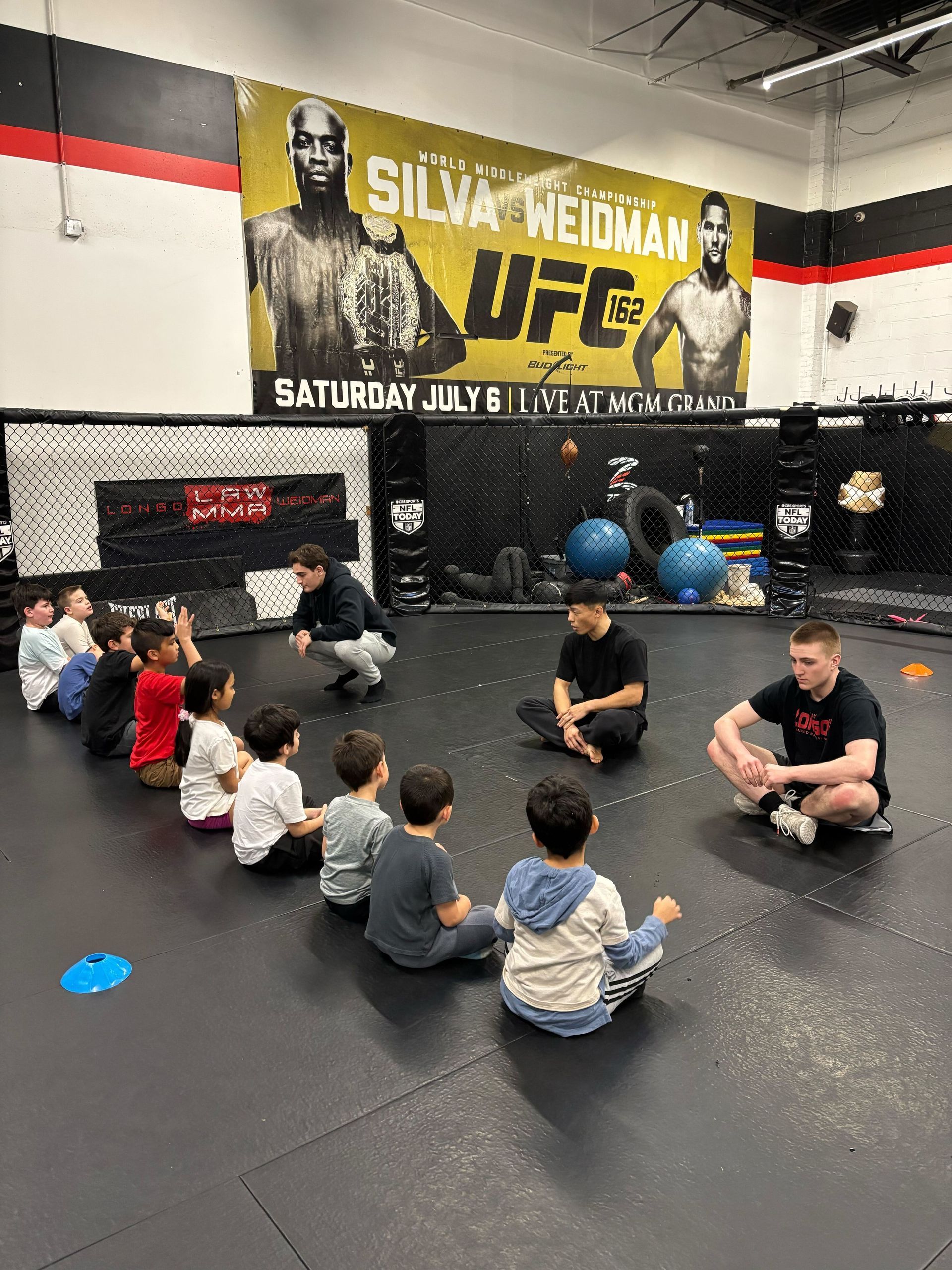 Kids practicing safe grappling drills at Ray Longo's Mixed Martial Arts in Garden City, NY.