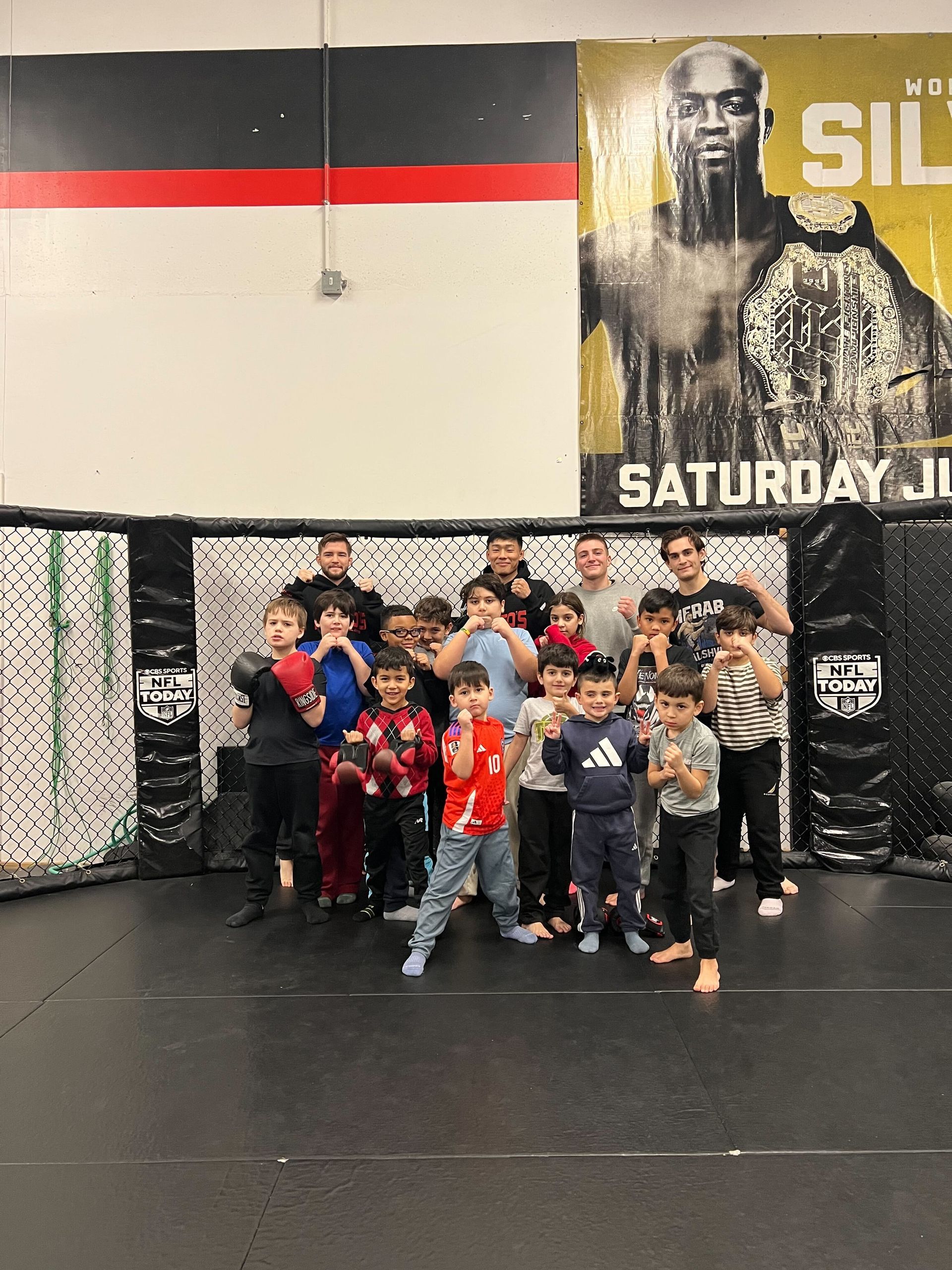 Kids practice safe grappling drills at Ray Longo's Mixed Martial Arts in Garden City, NY.