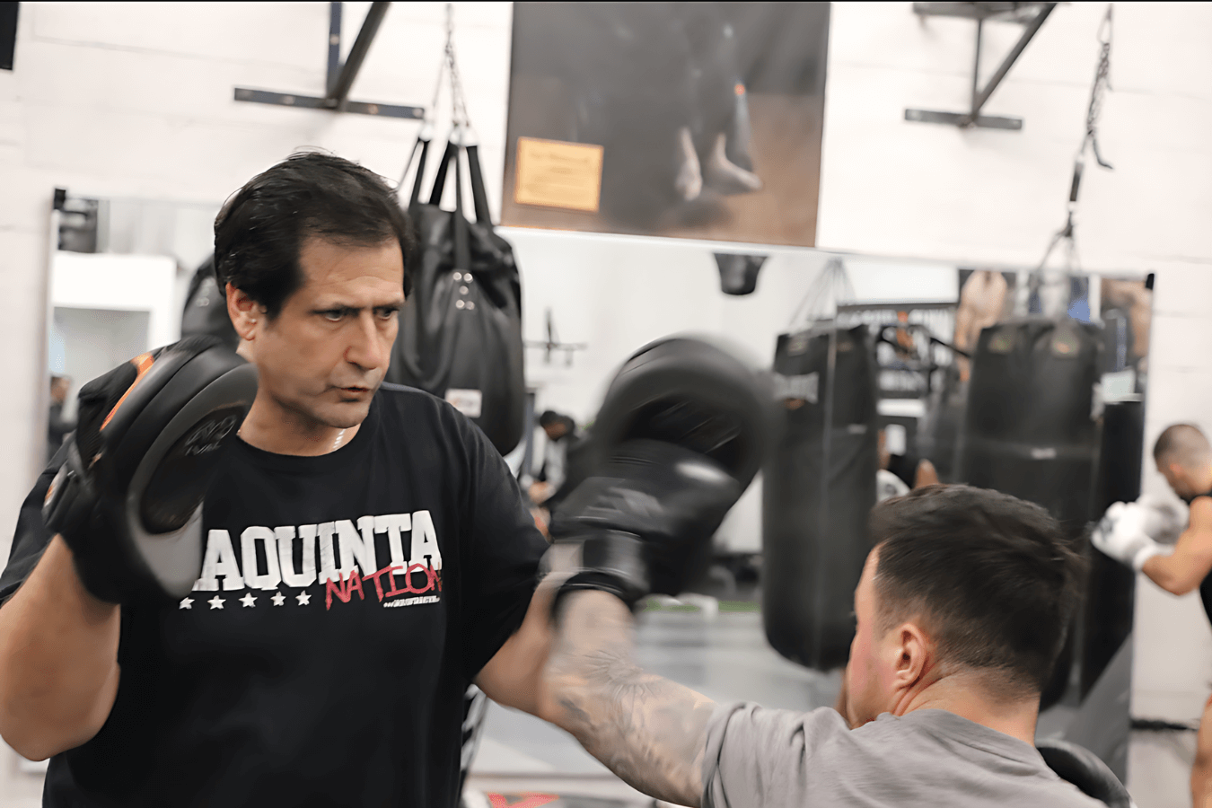 Adults practicing striking and grappling drills at Ray Longo's Mixed Martial Arts in Garden City, NY