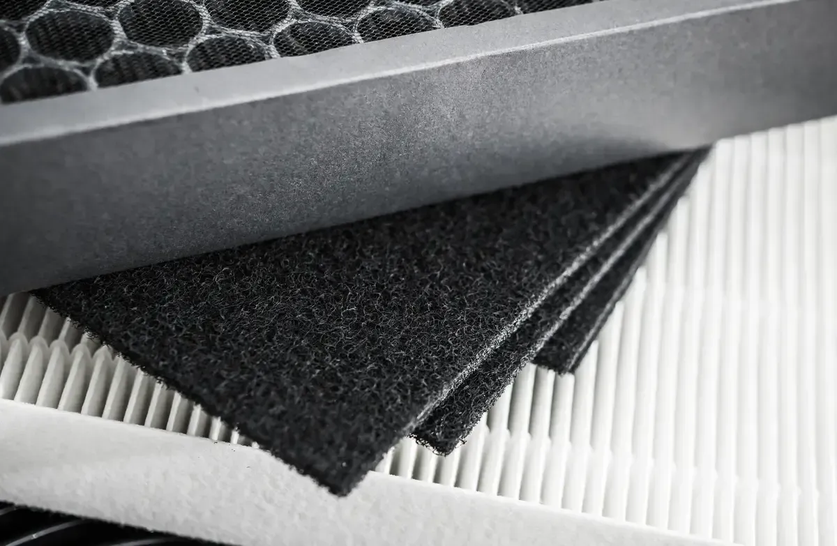 A close up of a stack of filters on top of each other on a table.