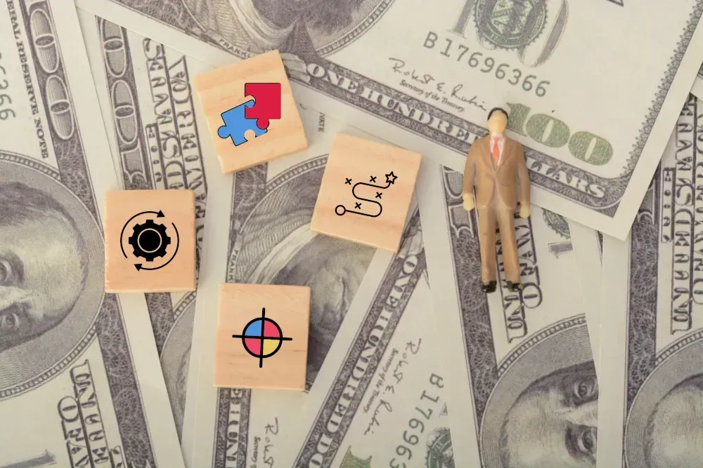 A miniature man is standing on a pile of money