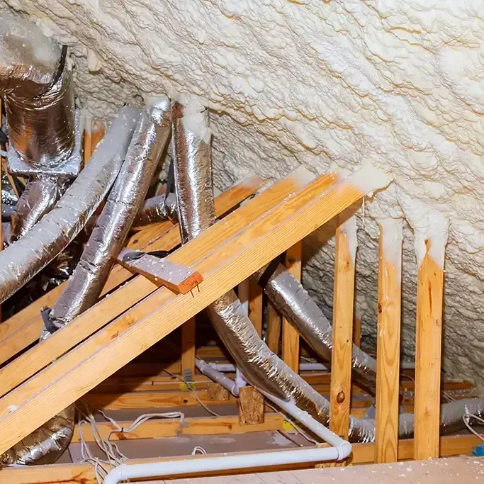 There is a lot of foam on the ceiling of the attic.