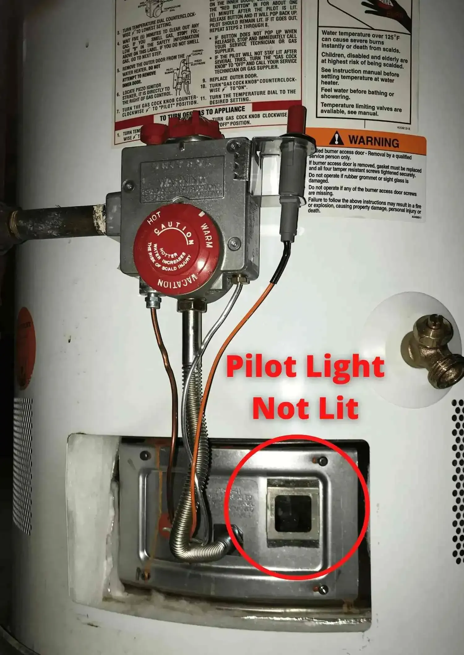 A water heater with a pilot light that is not lit.