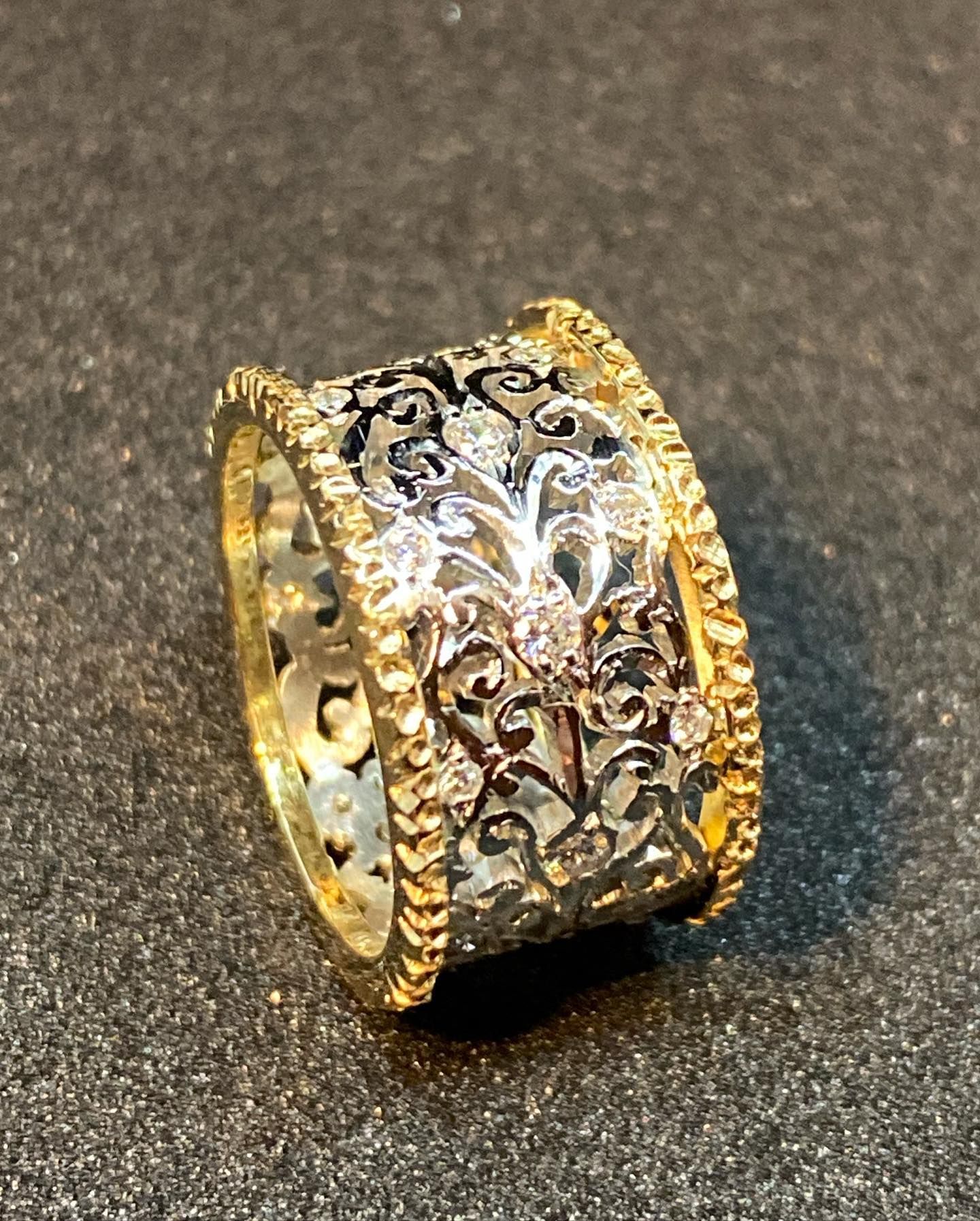 Silver Ring Setting With Blue Gemstone and Tools on a Workbench — Burchell's Jewellers In Sydney, NSW