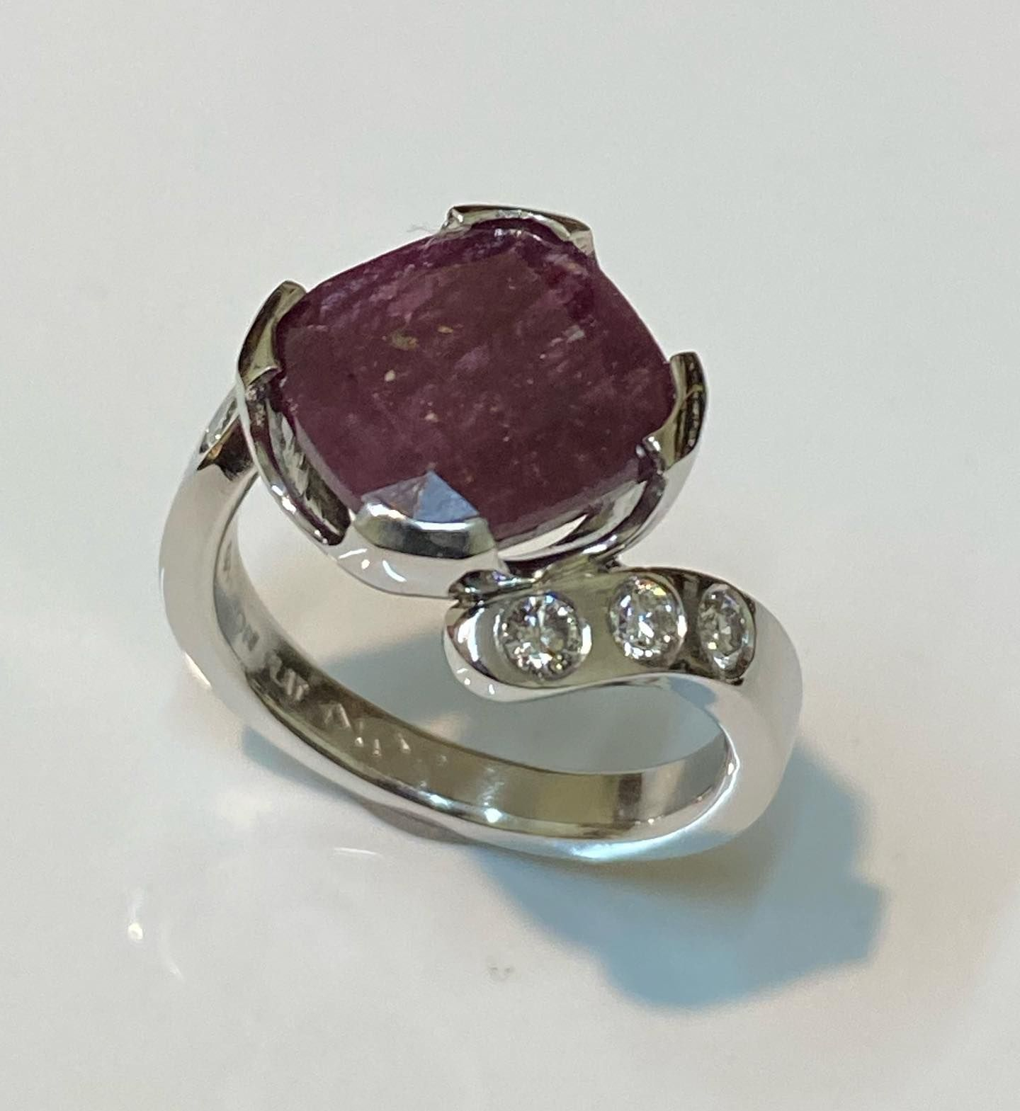 Silver Ring With a Large, Faceted, Reddish-purple Gemstone — Burchell's Jewellers In Wollongong, NSW