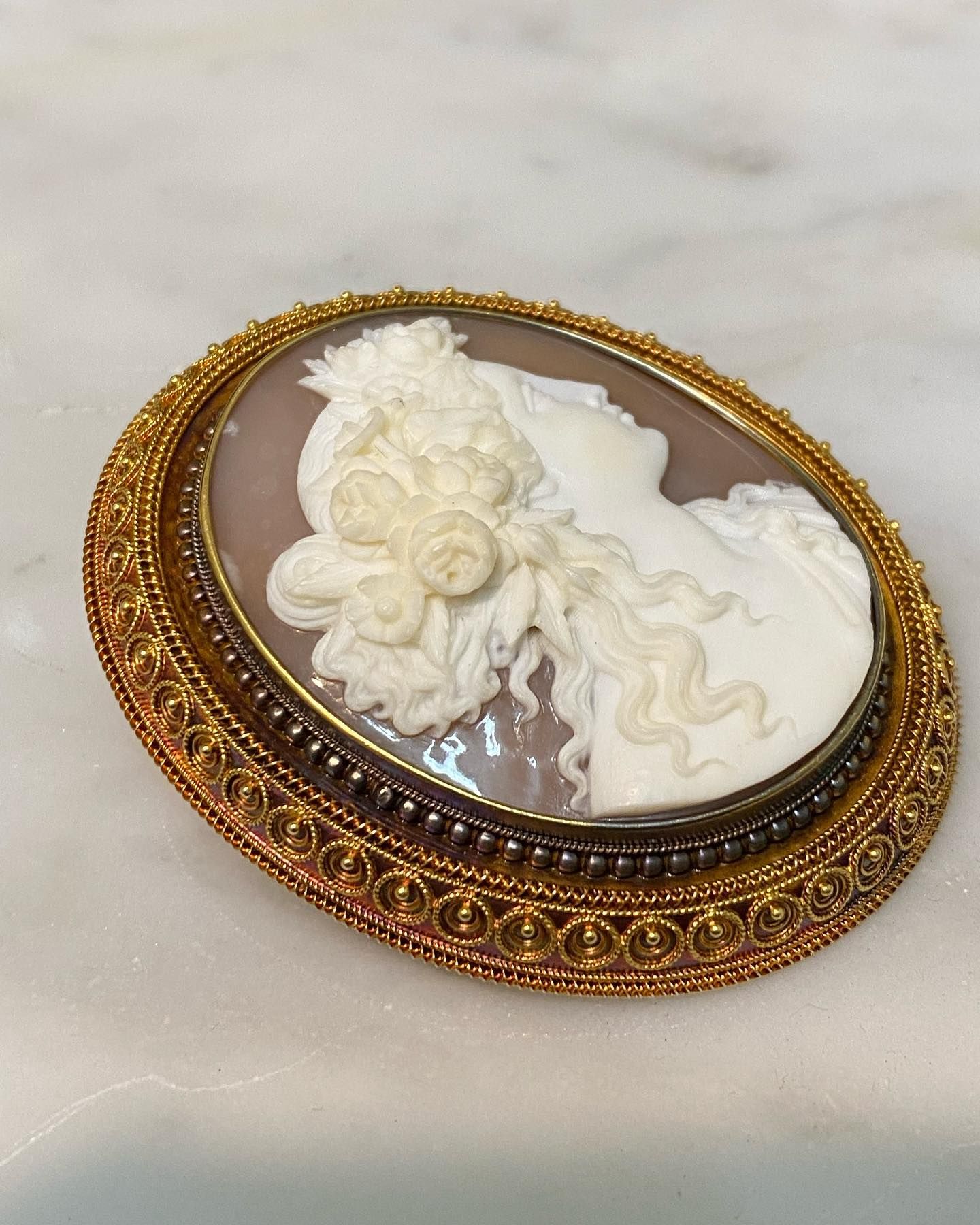 Oval Cameo Brooch With a White Profile Carving of a Woman With Ornate Hair — Burchell's Jewellers In Canberra, NSW