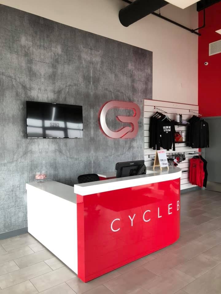 A red and white reception desk branded