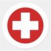 A red cross in a white circle on a white background.