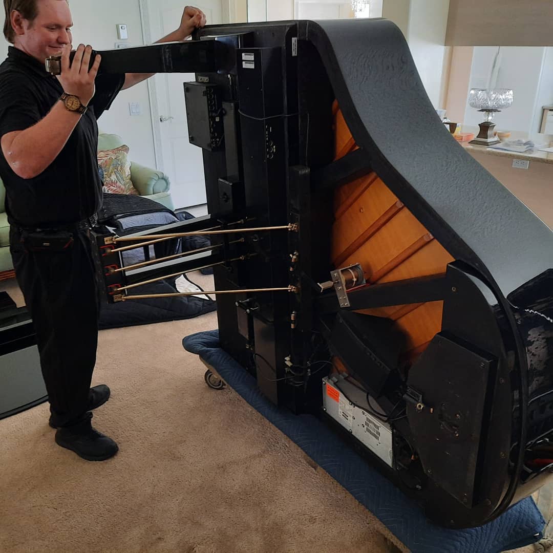 Baby Grand Piano on Cart  Ready for Moving — Summerfield, FL — Florida Piano Services. LLC