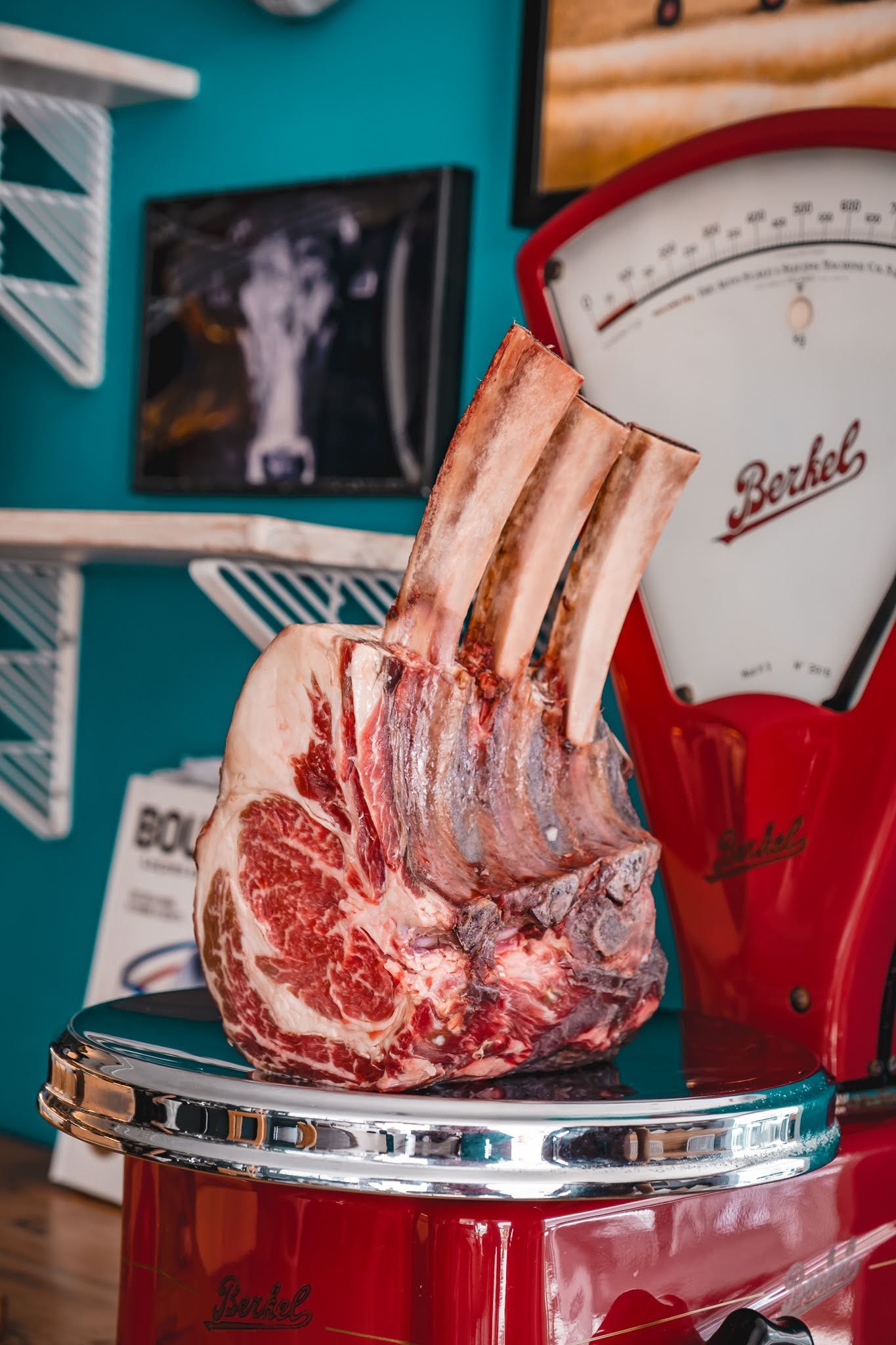 Vintage red-and-silver decor with a carved bacon sculpture on a chrome stand