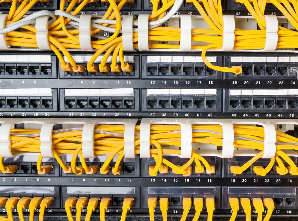 Yellow Network Cables Connected to a Patch Panel — Powered By JBES In Sandgate, NSW