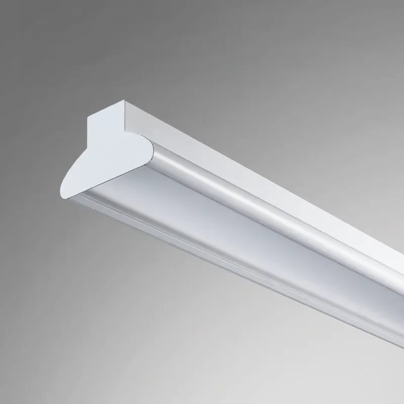 White linear LED pendant luminaire suspended by cables.