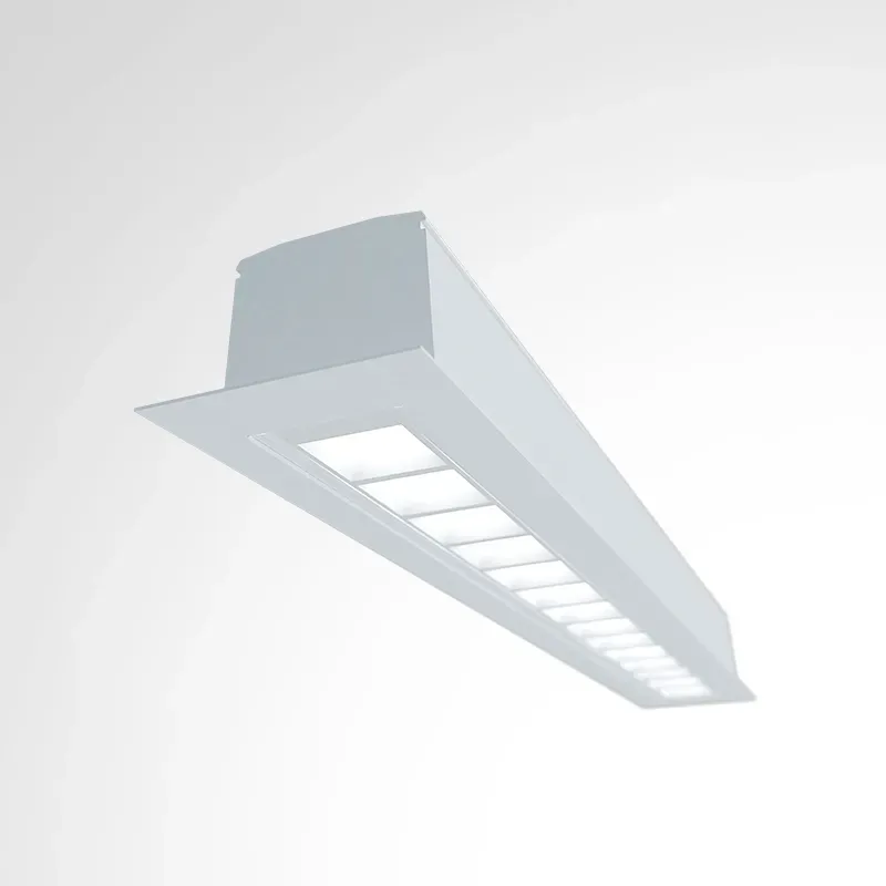 Surface-mounted linear LED luminaire with integrated shielding.