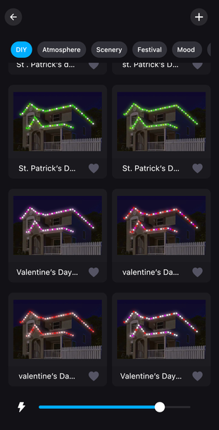 Dark-themed phone screen showing a grid of house light decoration clips in green, purple, red, and white.