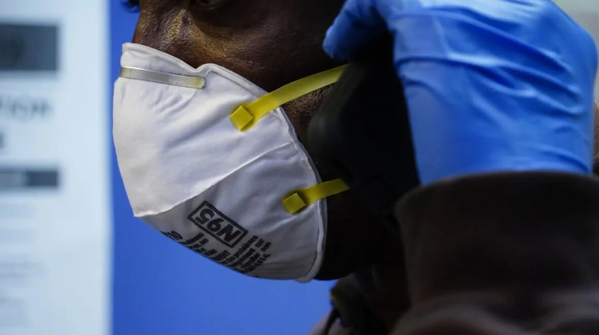 a person wearing a mask that says n95 on it