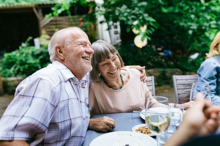 An Elderly Couple Is Sitting at A Table | Columbus, GA | Sweet Home Care An Elderly Couple Is Sitting at A Table | Columbus, GA | Sweet Home Care