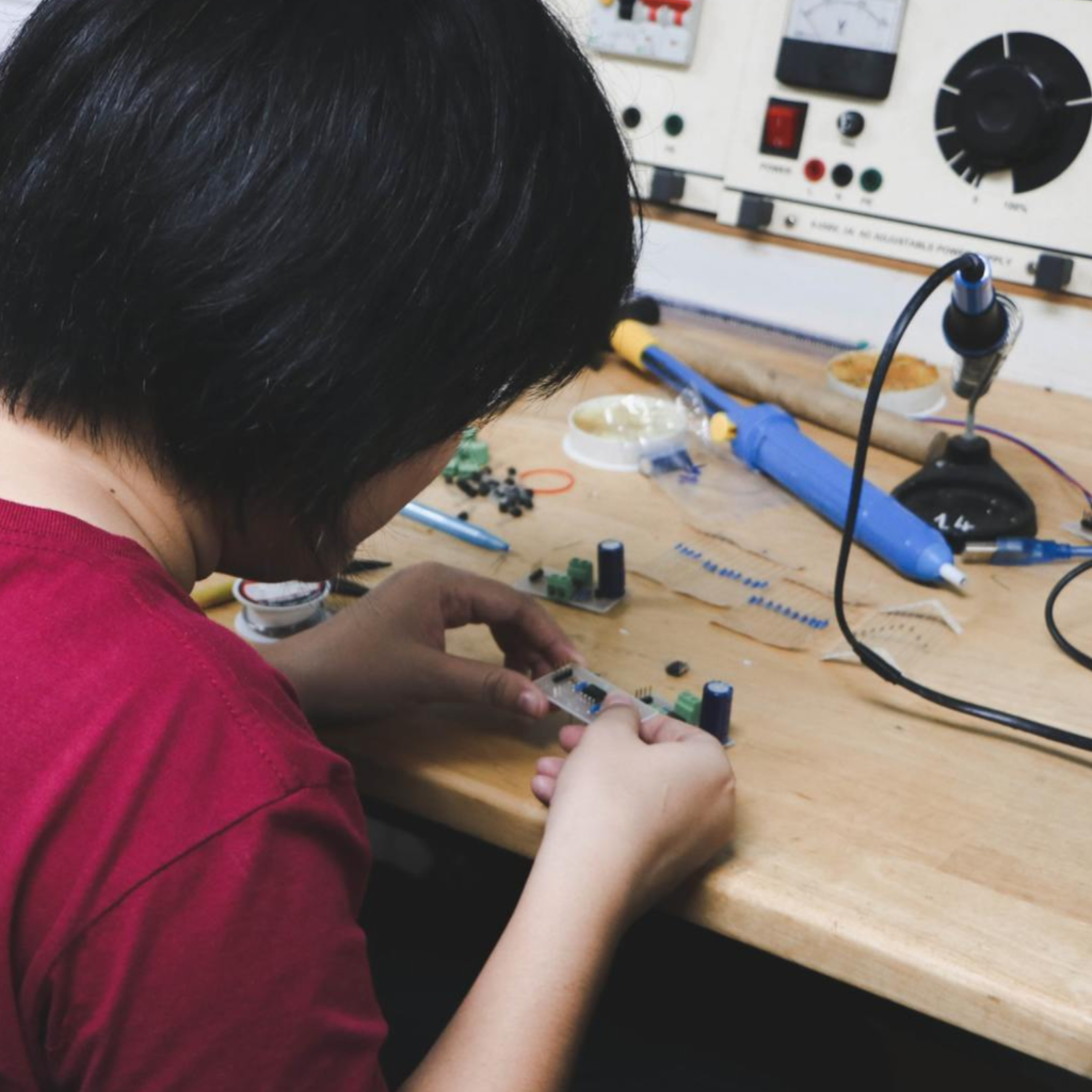 worker repairing parts of a gas monitor