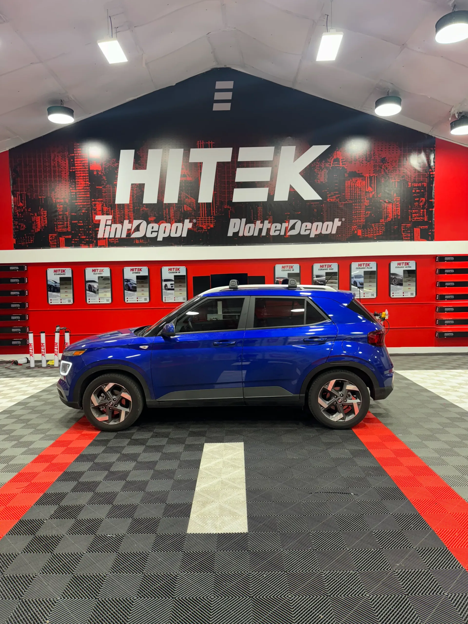 Blue Hyundai SUV in a garage with 