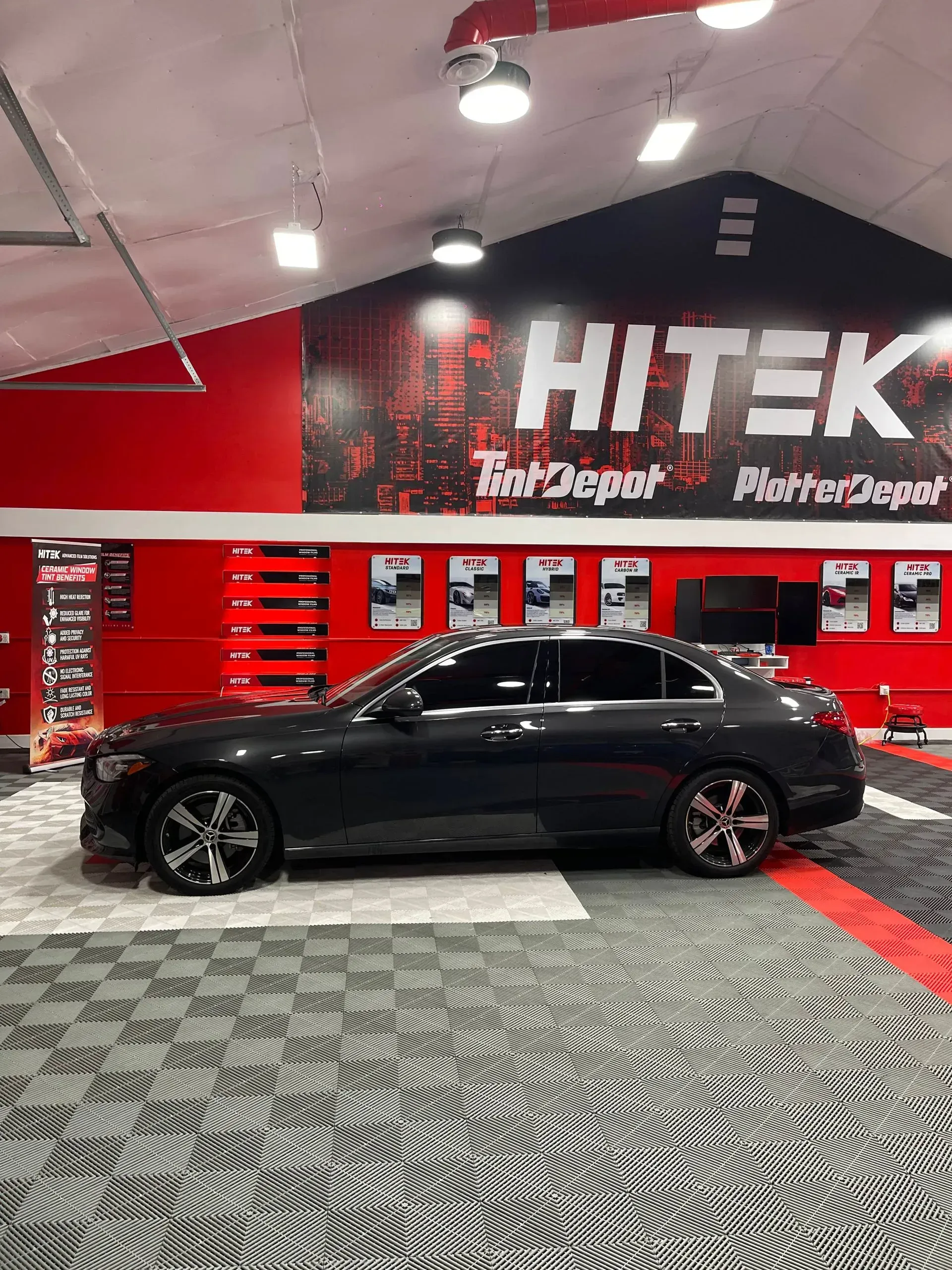 Dark car inside a shop with 