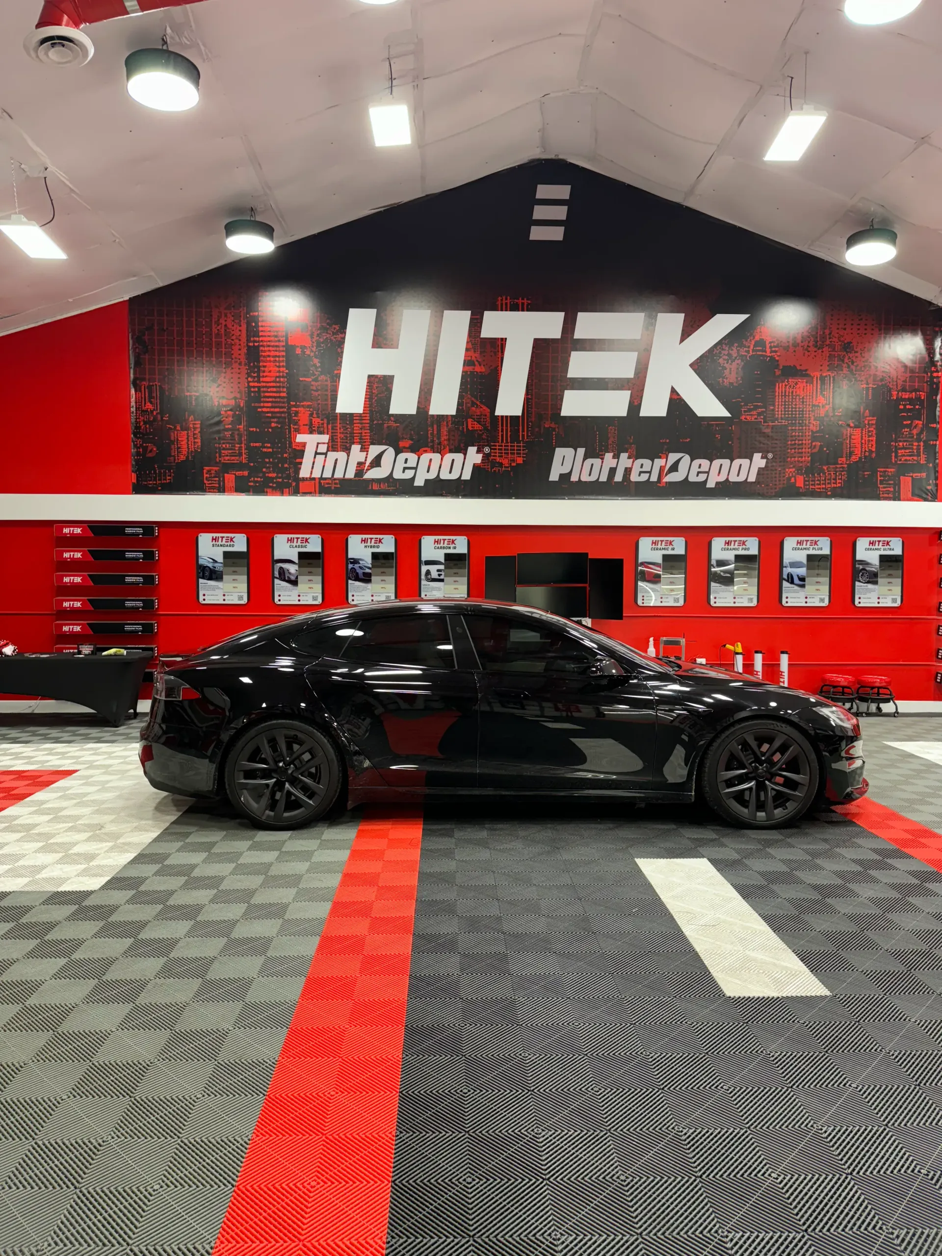 Black car in a shop with 