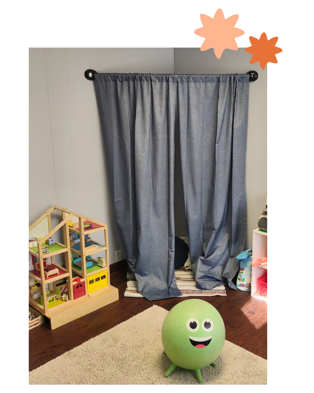 Gray curtains over a window in a child’s room, with a green smiling ball on the floor and a toy dollhouse nearby.