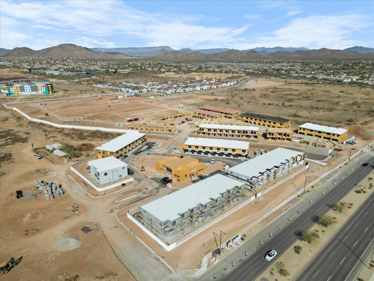 An aerial view of a building under construction in the desert.
