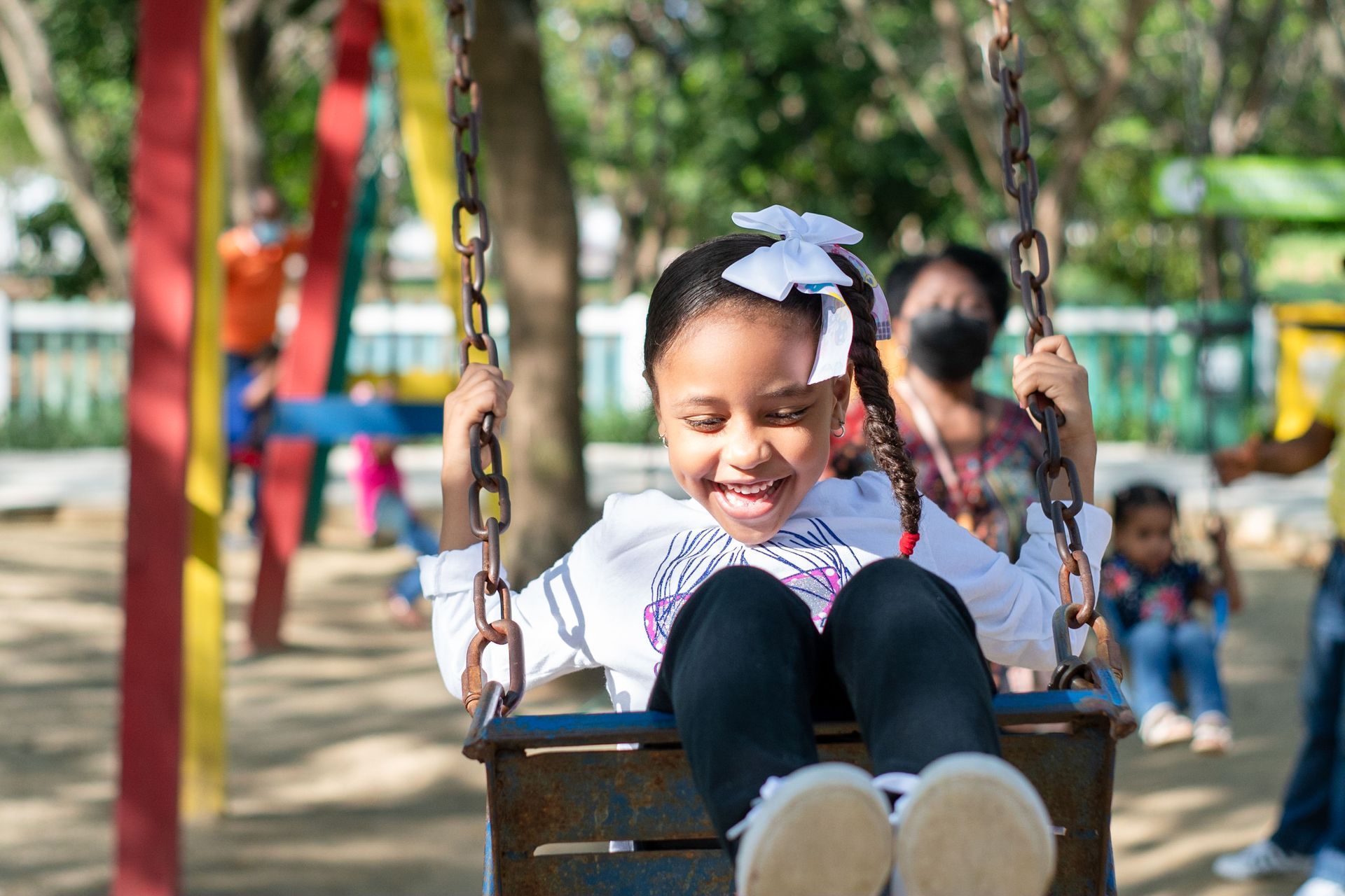 Child at Playground On a Swing