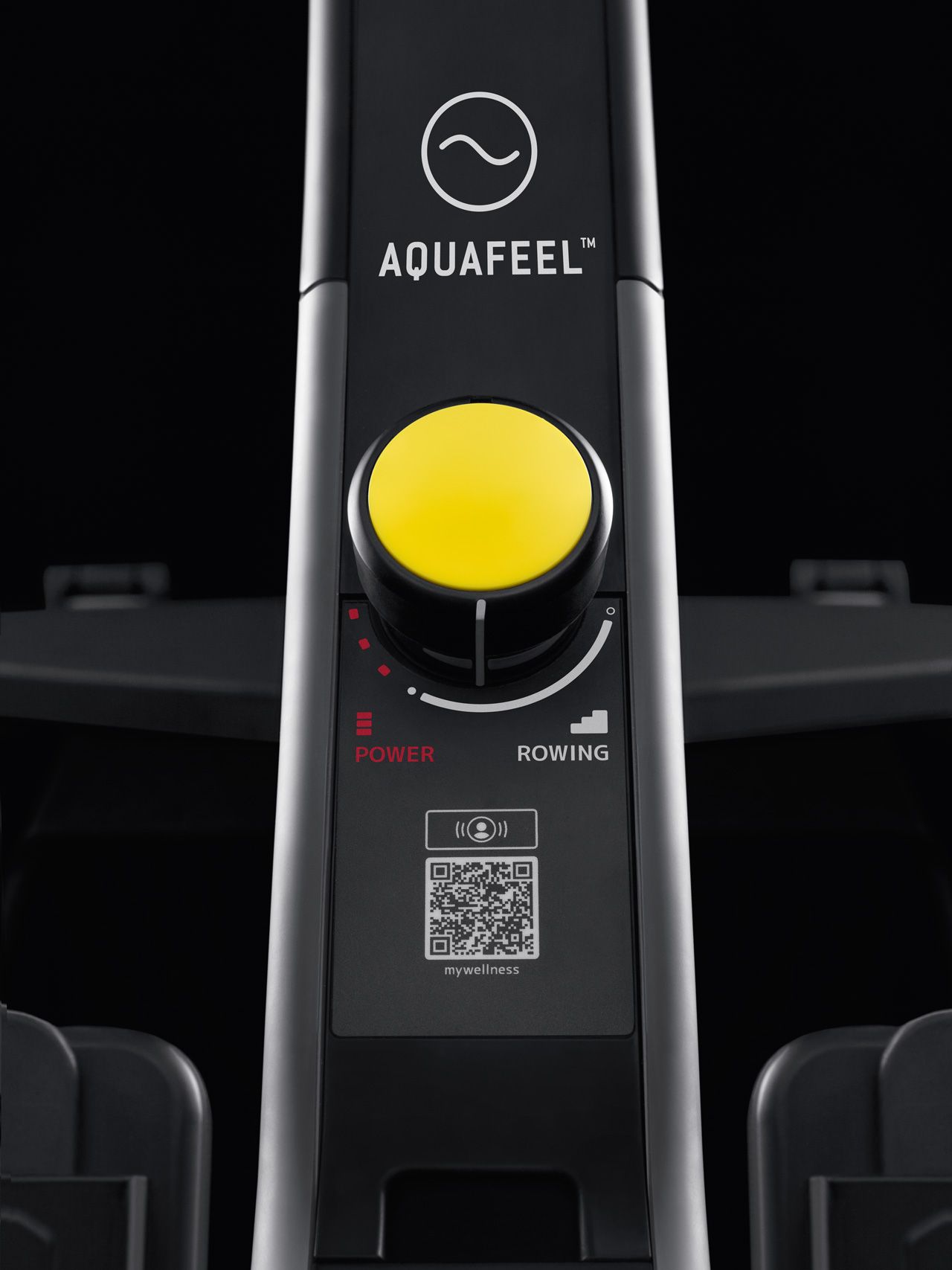 Close-up of a black Aquafeel exercise machine control panel featuring a large yellow dial and a QR code.