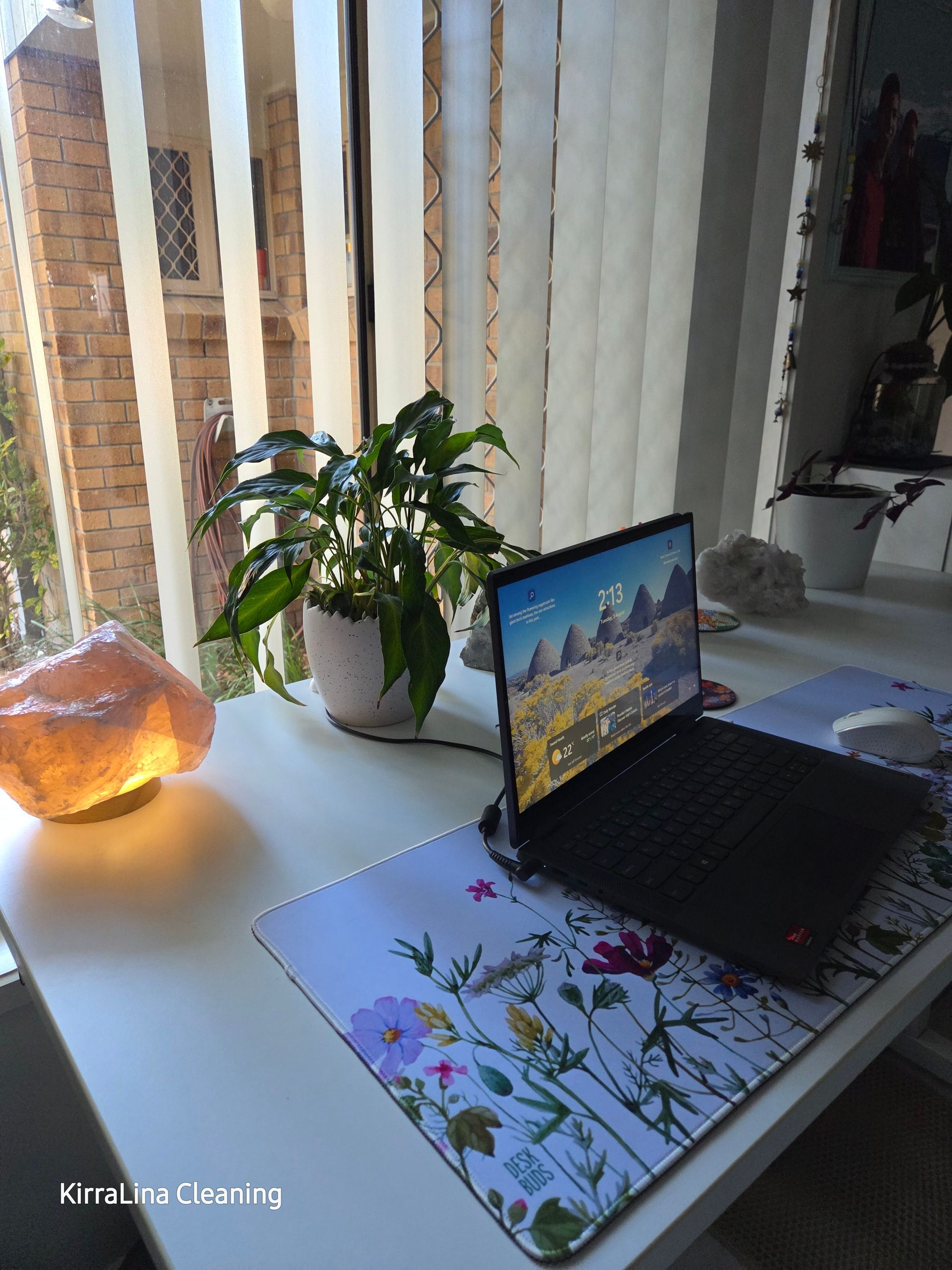 A Laptop on A Desk with A Salt Lamp — KirraLina Cleaning Services in Gold Coast, QLD