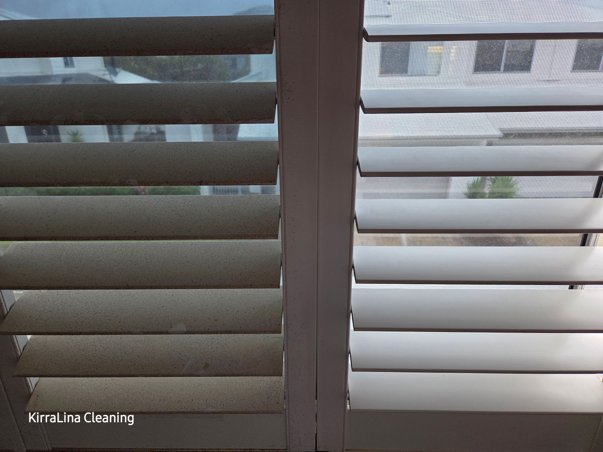 Close-up of White Window Blinds With a Narrow Gap — KirraLina Cleaning Services in Tweed Heads, NSW