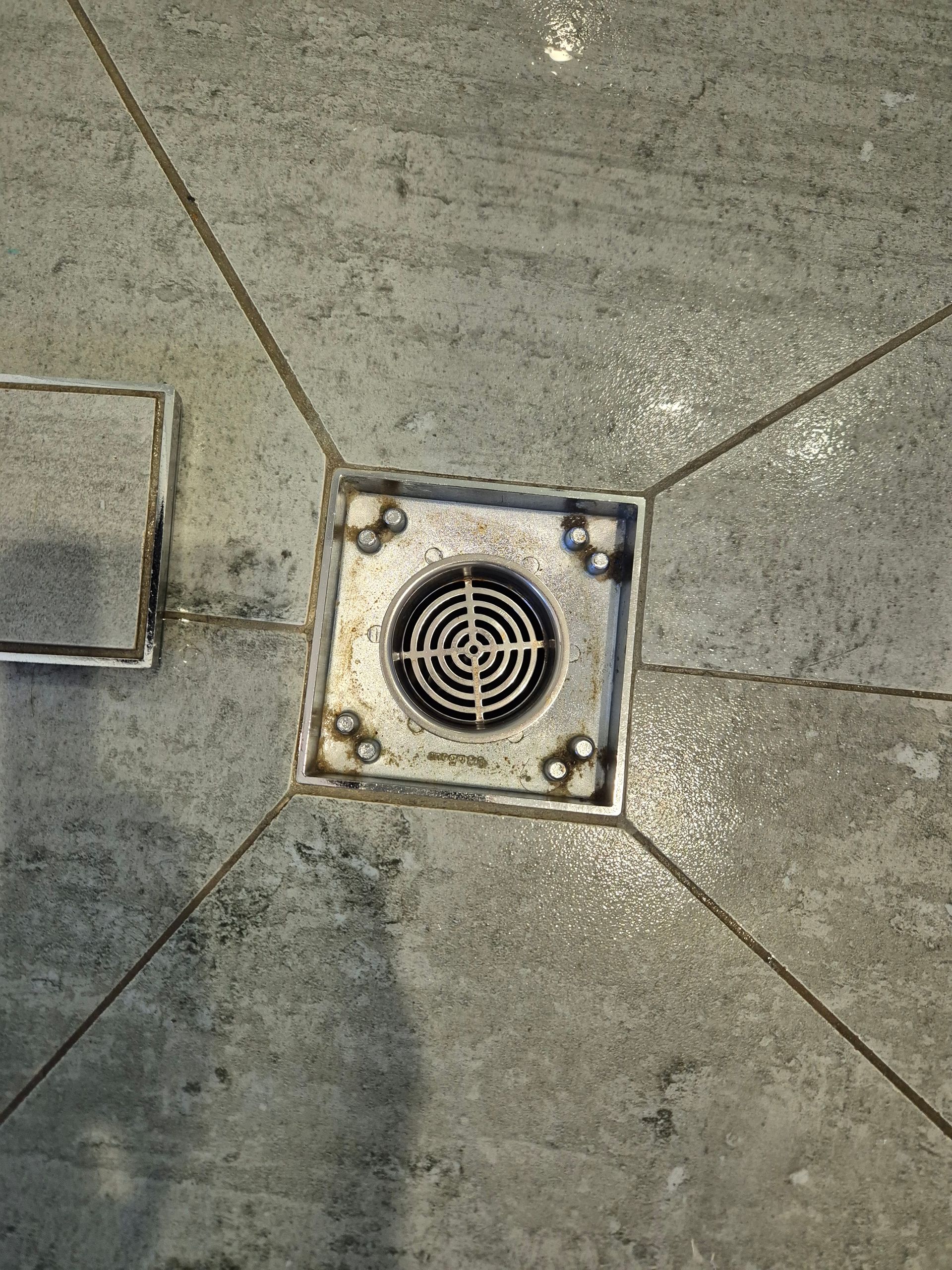After: Metal Floor Drain in Grey Tiled Floor — KirraLina Cleaning Services in Gold Coast, QLD