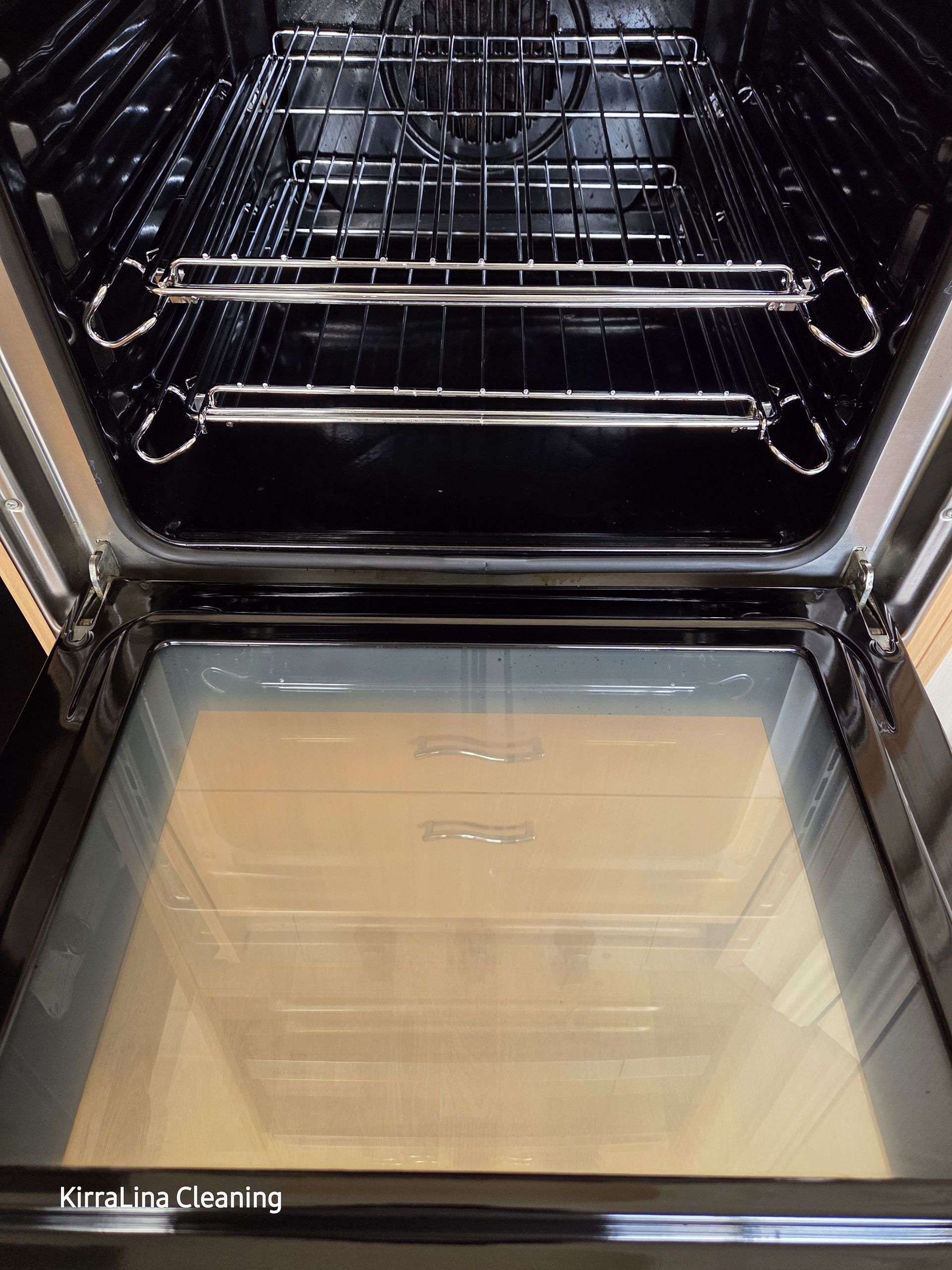 Open Oven With Wire Racks and a Glass Door, Showing the Interior and Empty Baking Trays — KirraLina Cleaning Services in Tweed Heads, NSW