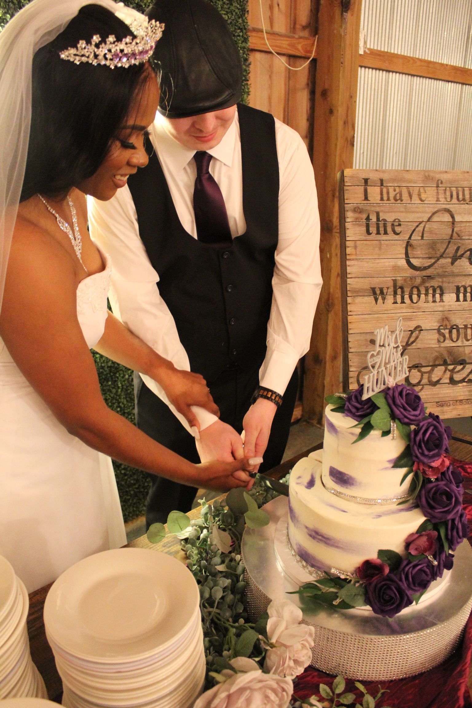 bride and groom cutting cake