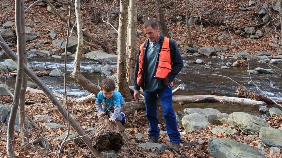 With grandson in forest