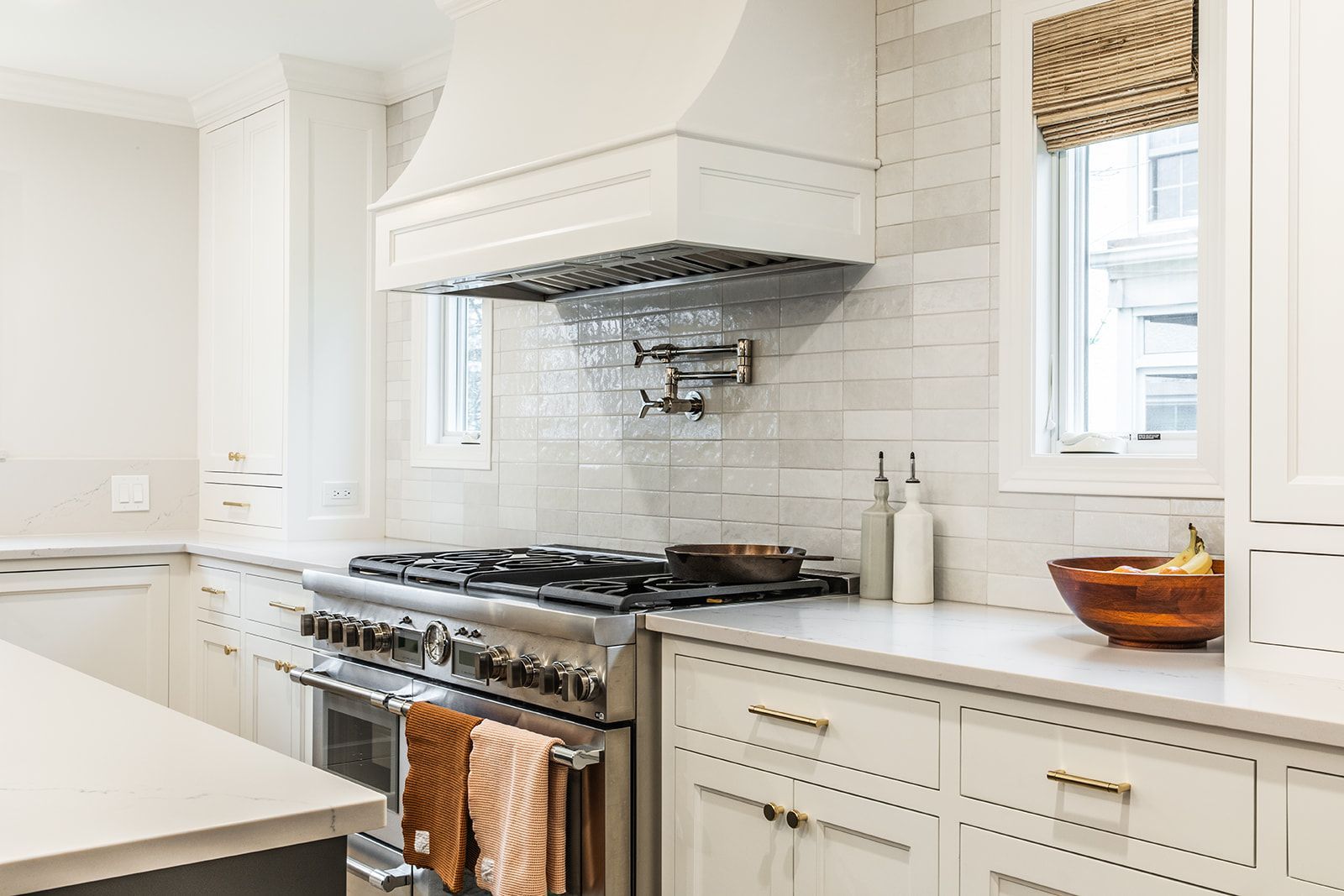A kitchen with white cabinets