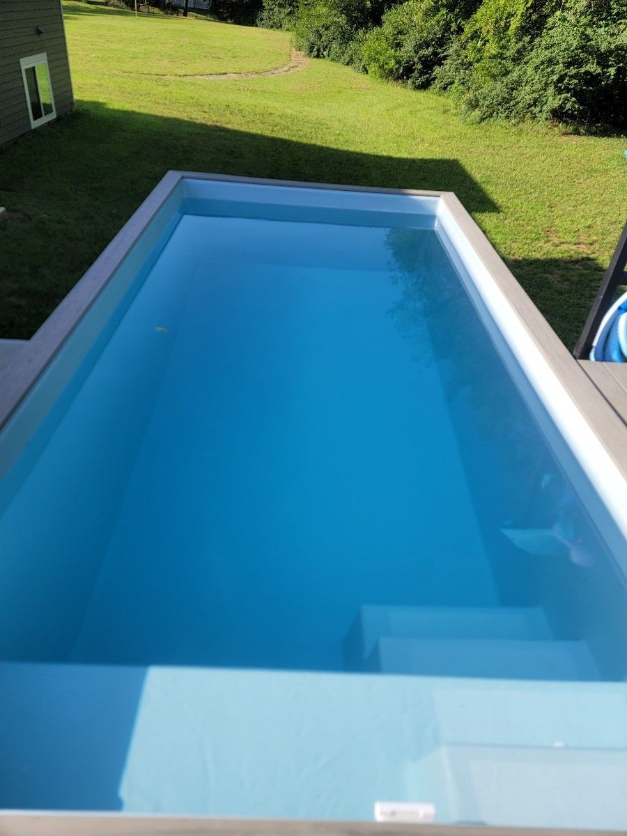 A large swimming pool filled with blue water