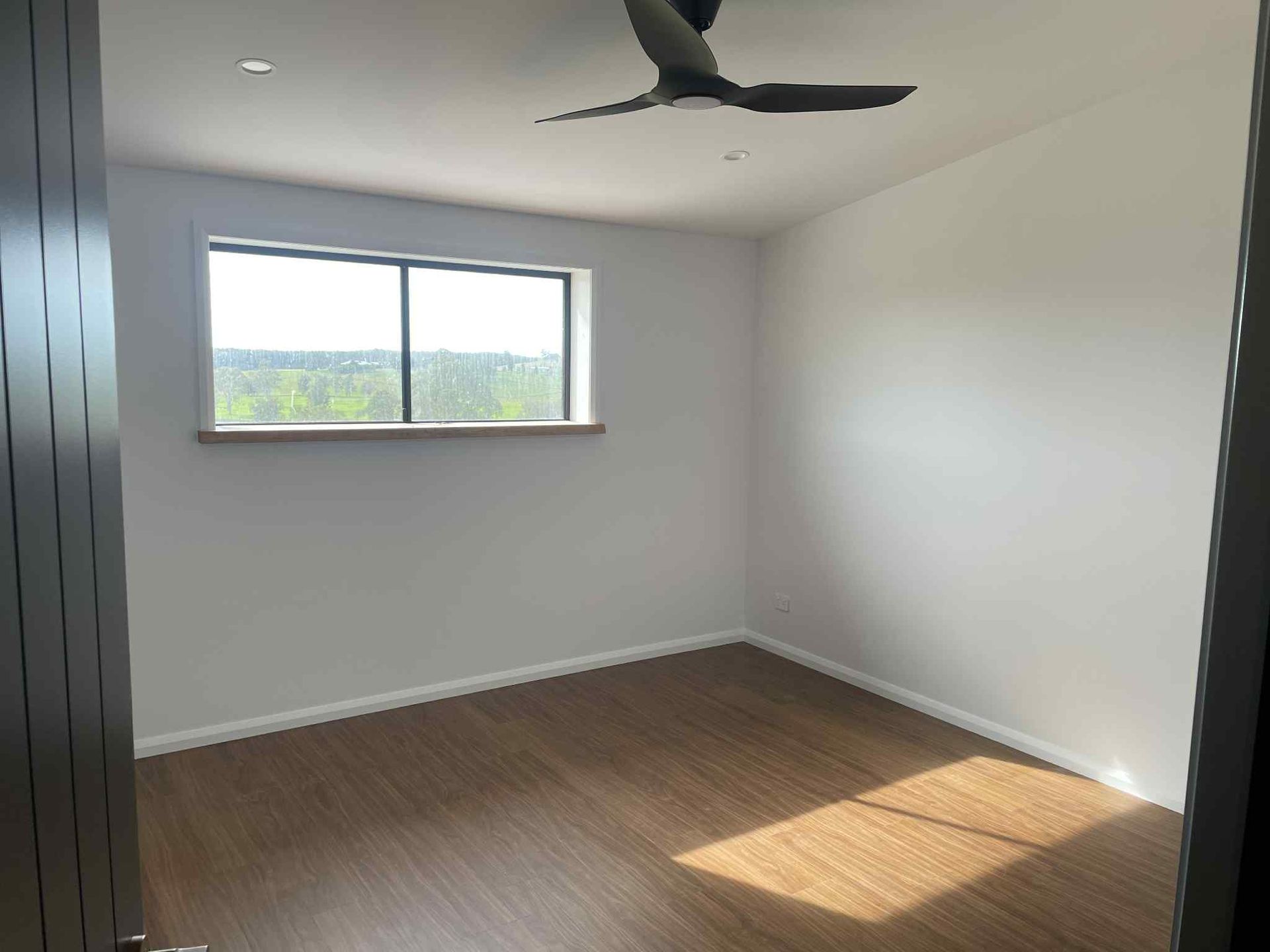 An Empty Room With a Lot of Windows and Drywall — Clean Line Plastering in Forster - Tuncurry, NSW