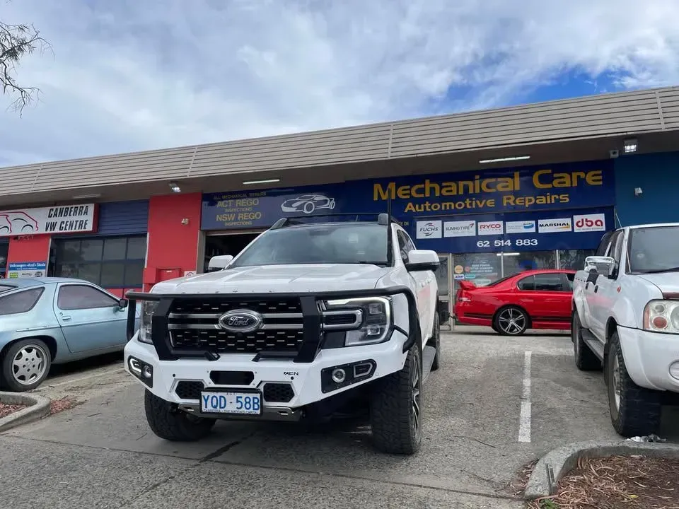 White Ford Pickup Truck Parked in Front of an Automotive Repair Shop — Mechanical Care in Belconnen, ACT
