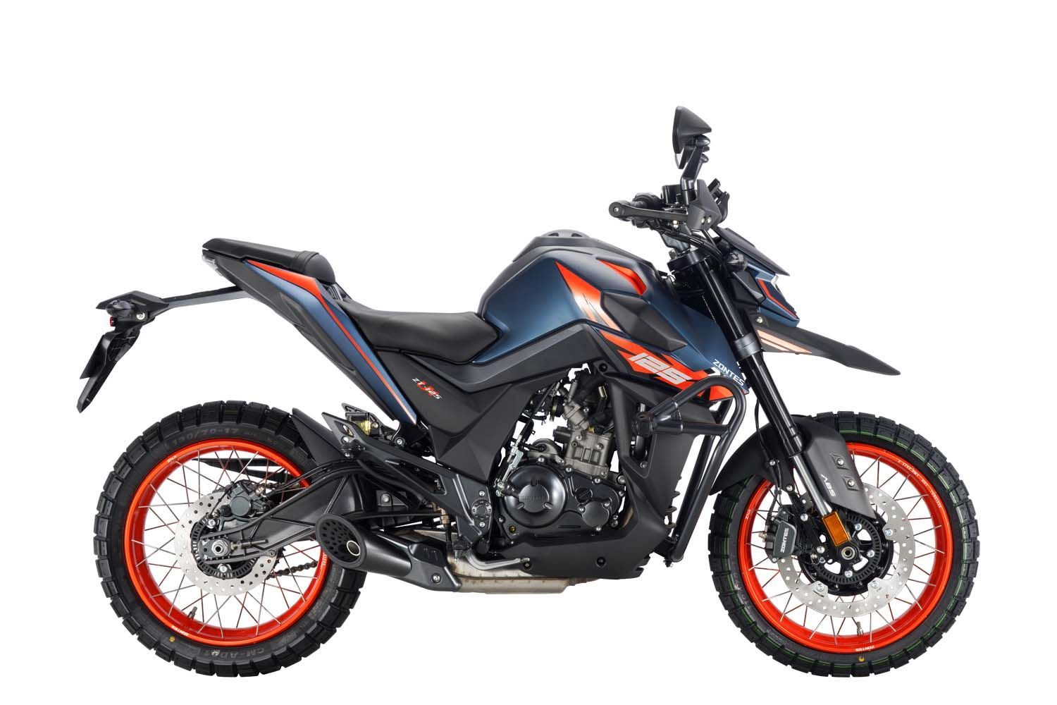 Blue and orange dual-sport motorcycle with spoked wheels and knobby tires.
