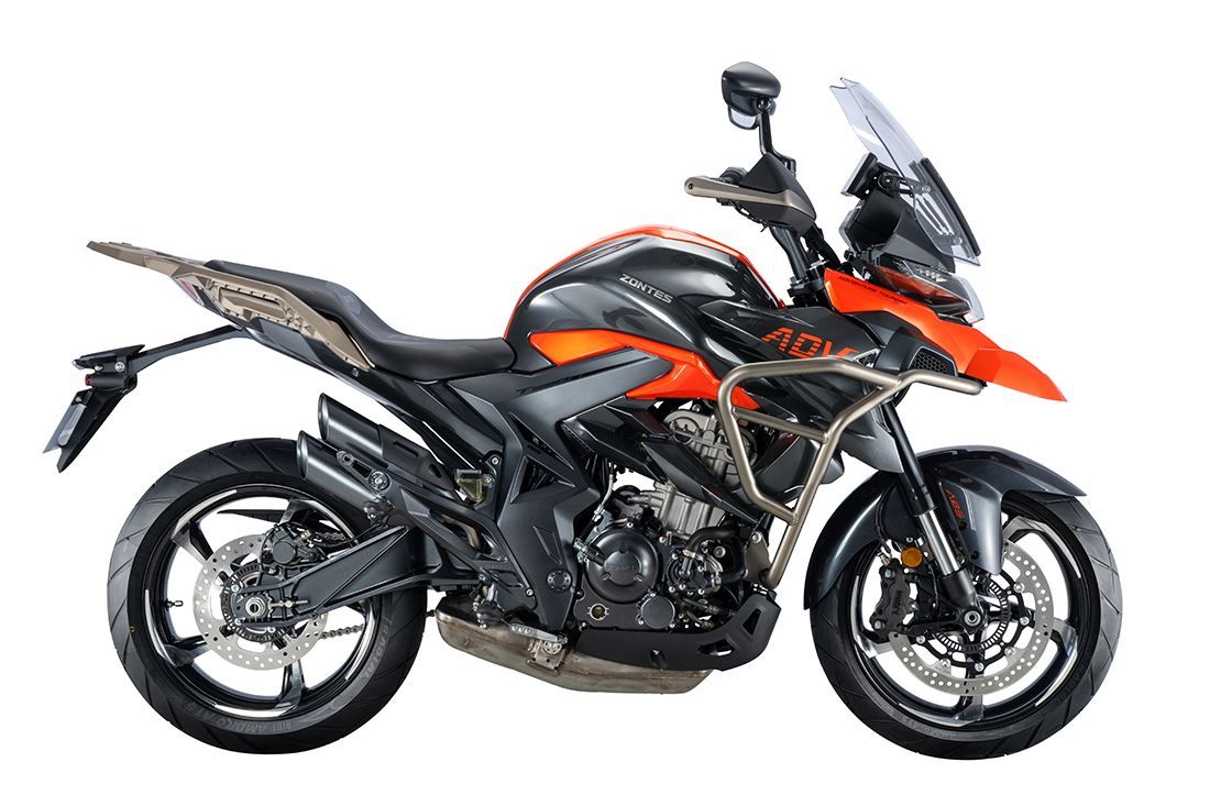 Orange and black adventure motorcycle on a white background.