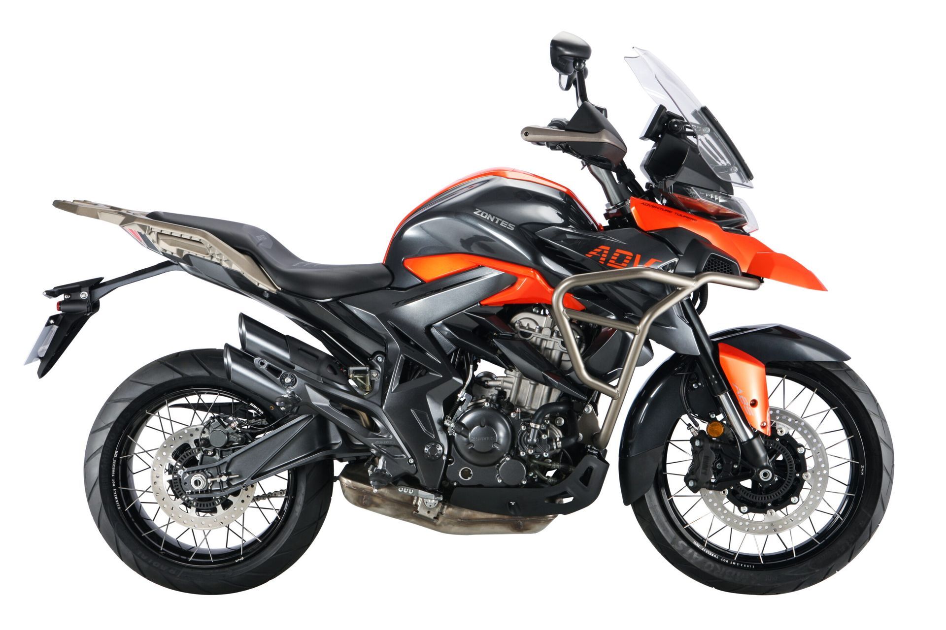 Black and orange adventure motorcycle with spoke wheels, crash bars, and a windshield.
