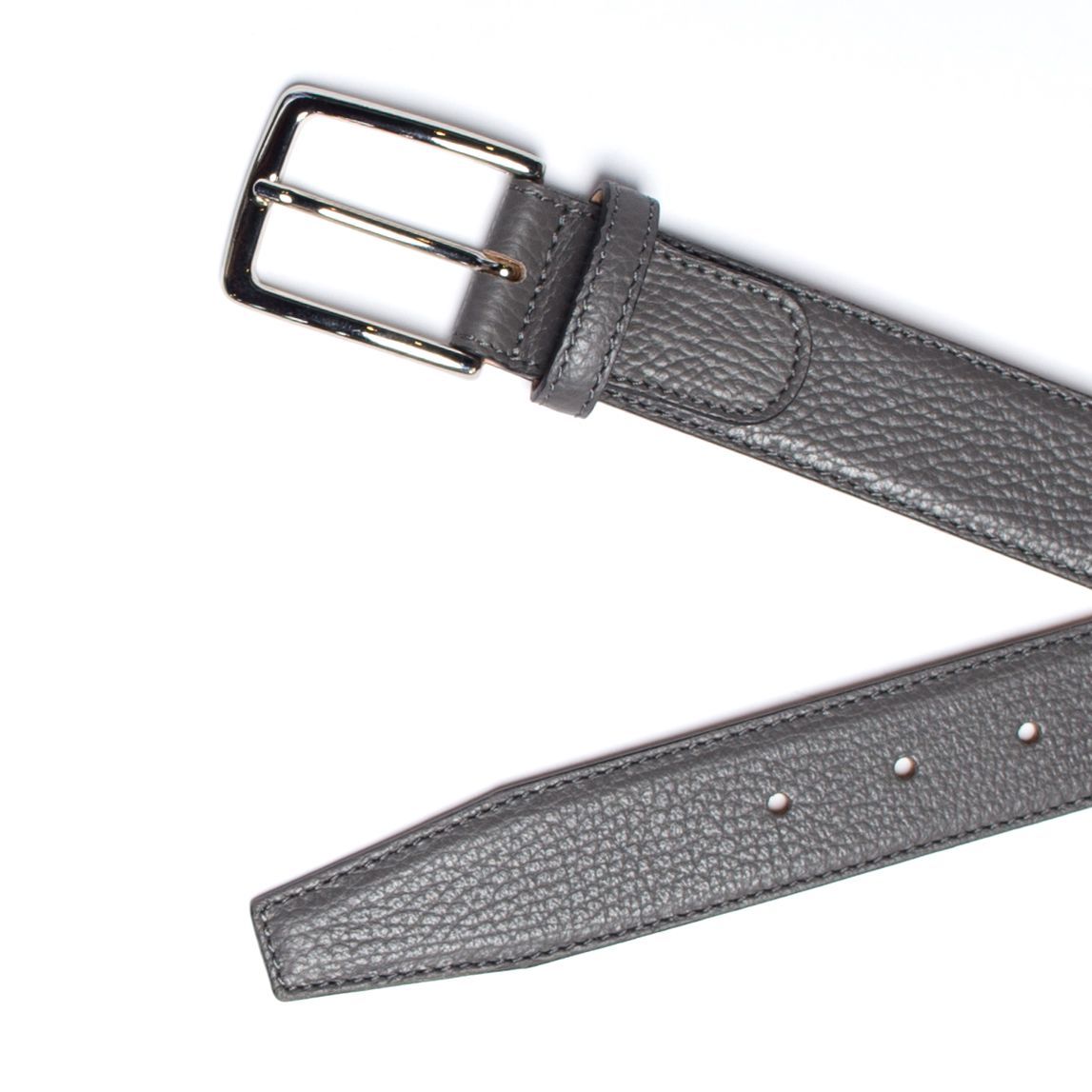 Gray leather belt with silver buckle, angled on a white surface.
