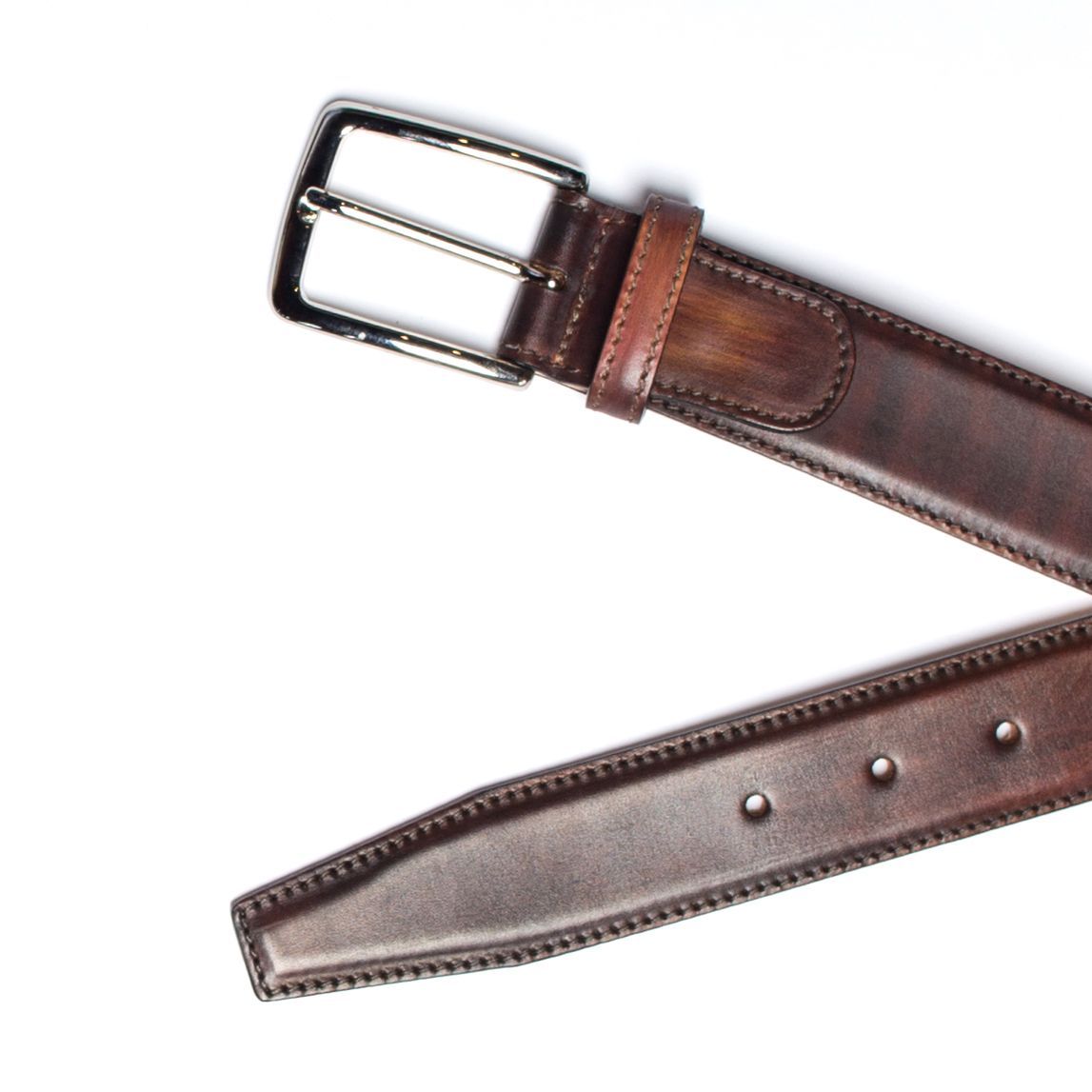 Brown leather belt with silver buckle, against a white background.