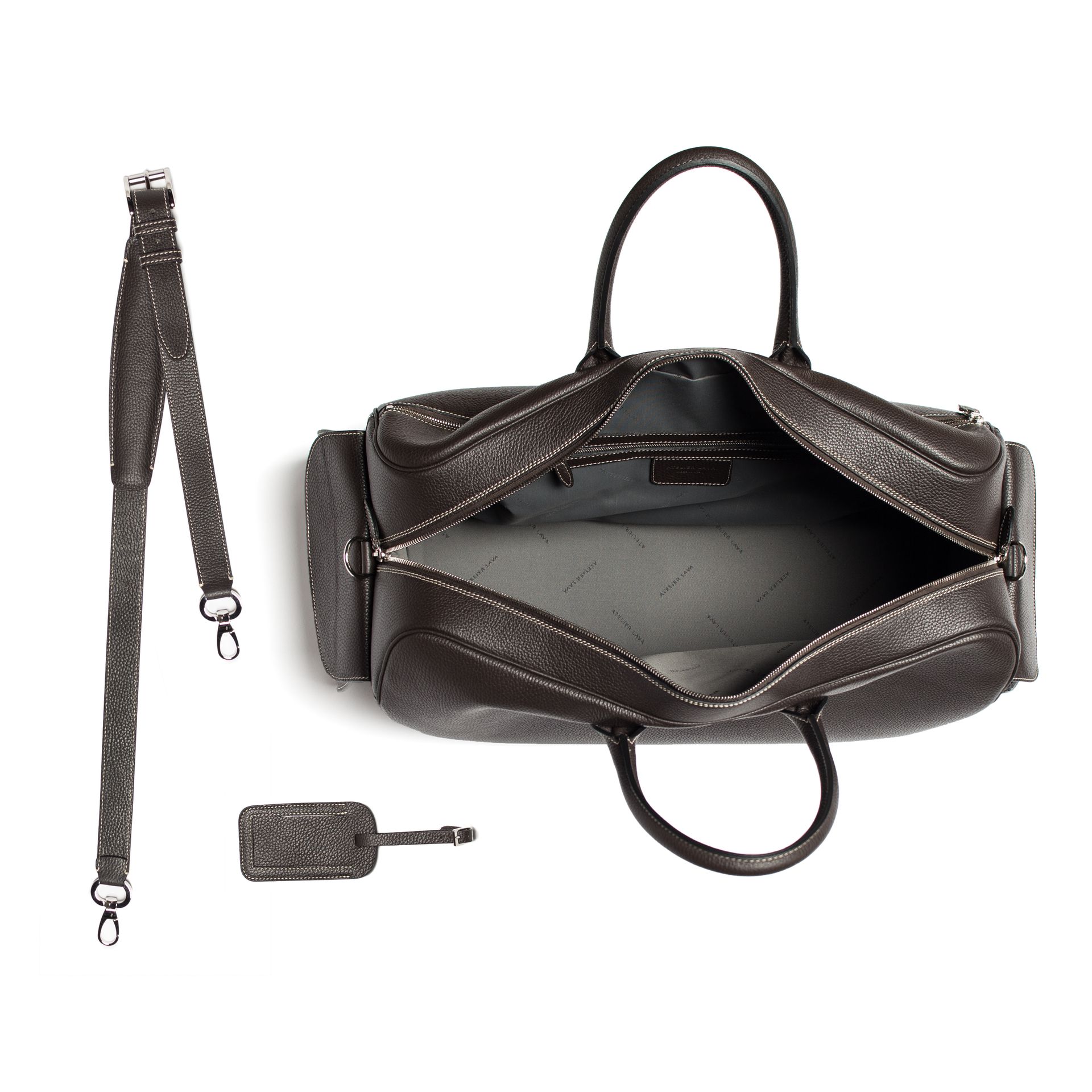 Brown leather duffel bag with open top, detachable shoulder strap, and luggage tag.