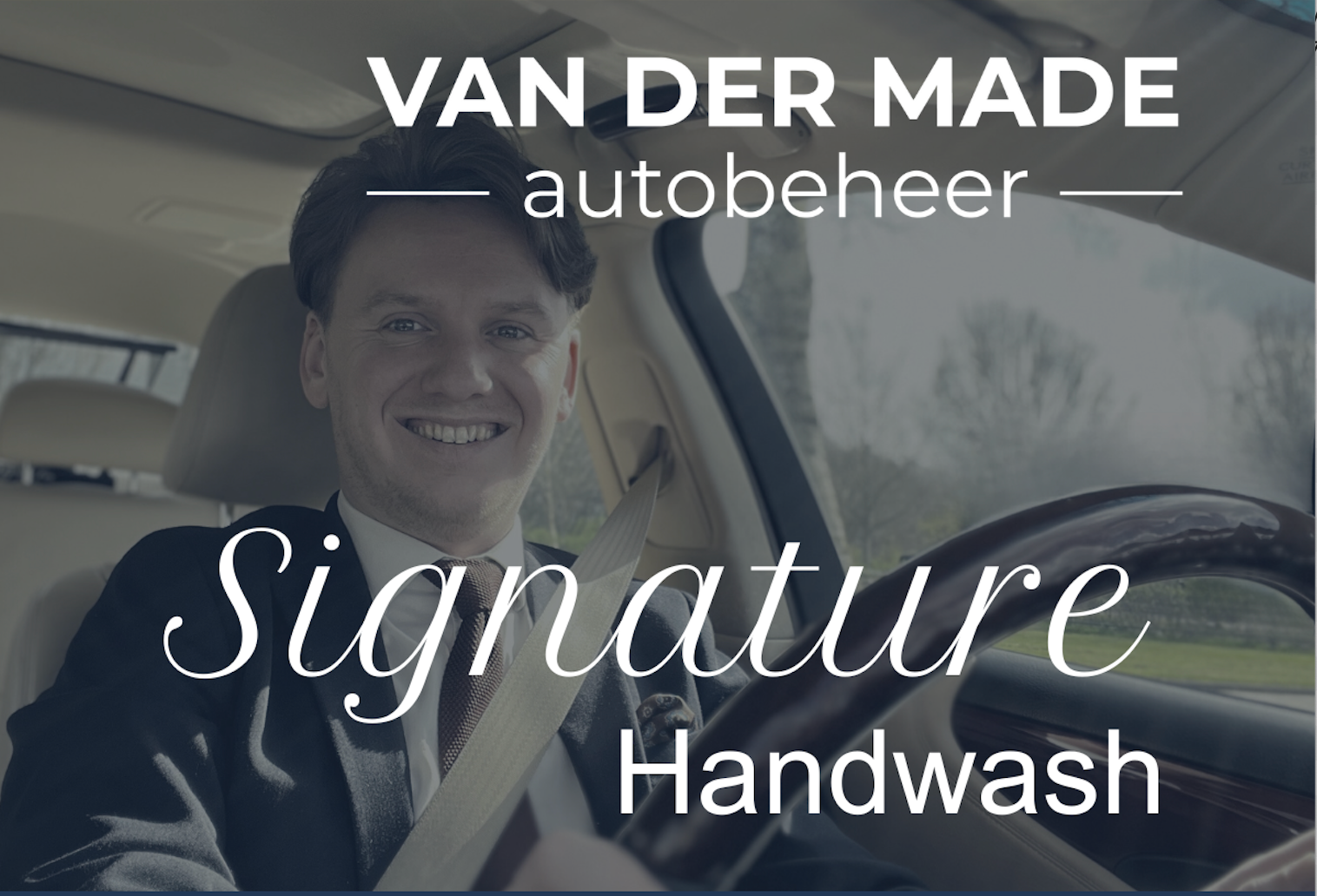 Man smiling, driving a car, 
